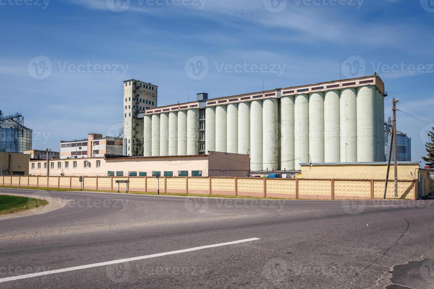 silos granary elevator on agro-industrial complex with seed cleaning and drying line for grain storage photo