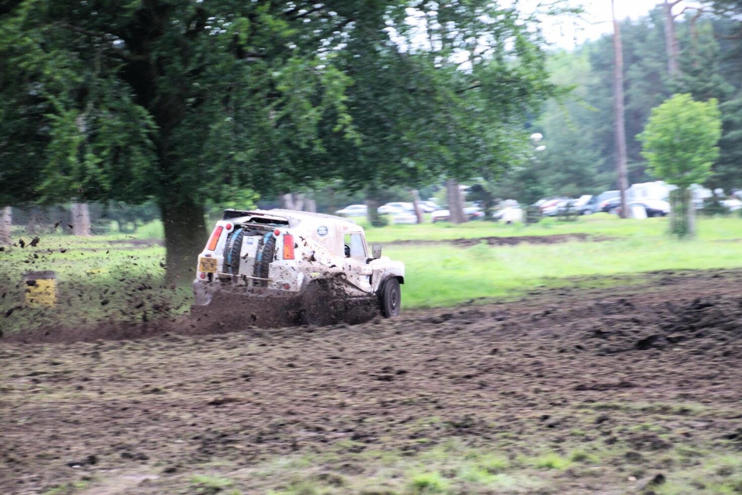 Malpas in Cheshire in the UK in September 2020. A view of a Landrover going through the mud in a field photo