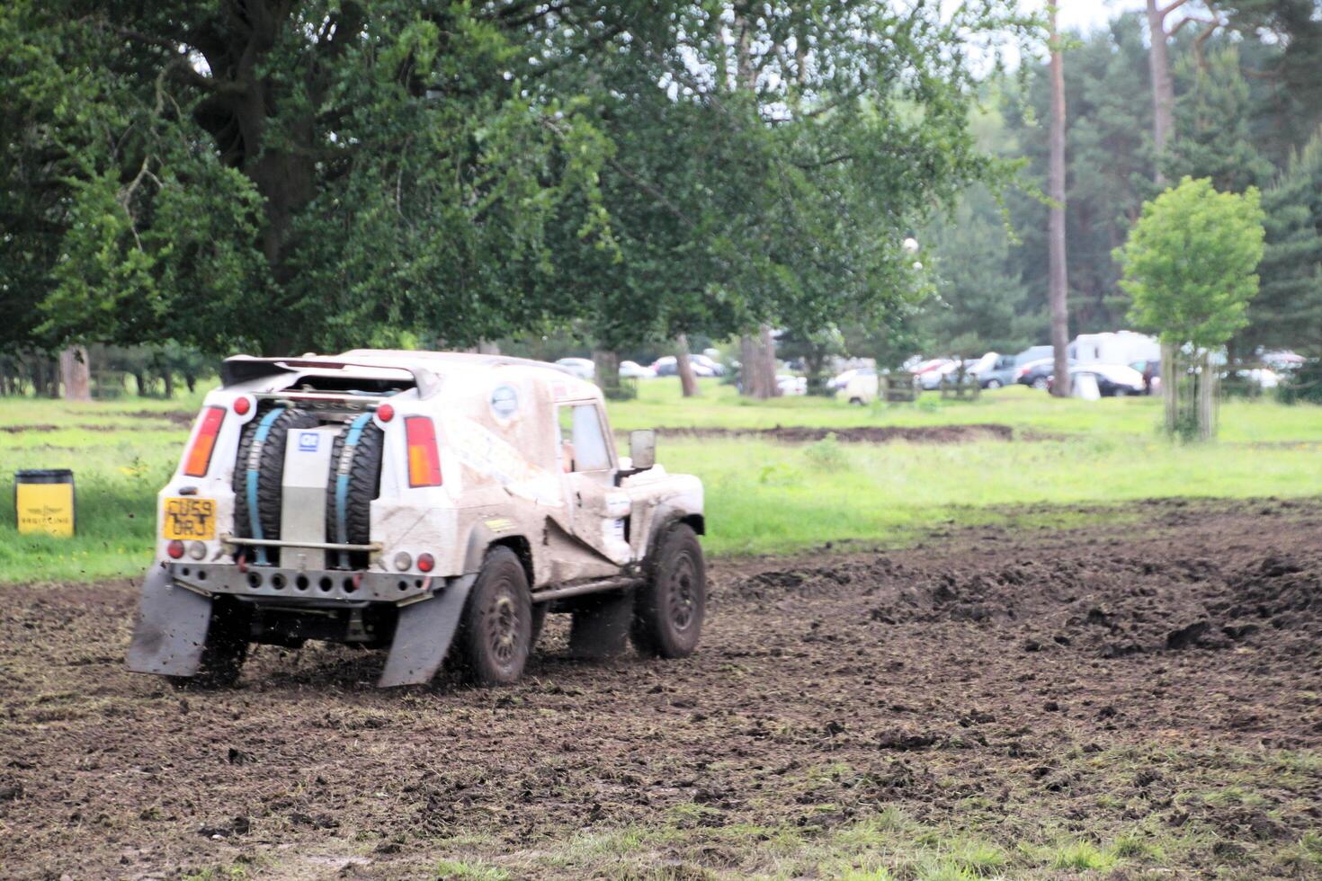 Malpas in Cheshire in the UK in September 2020. A view of a Landrover going through the mud in a field photo