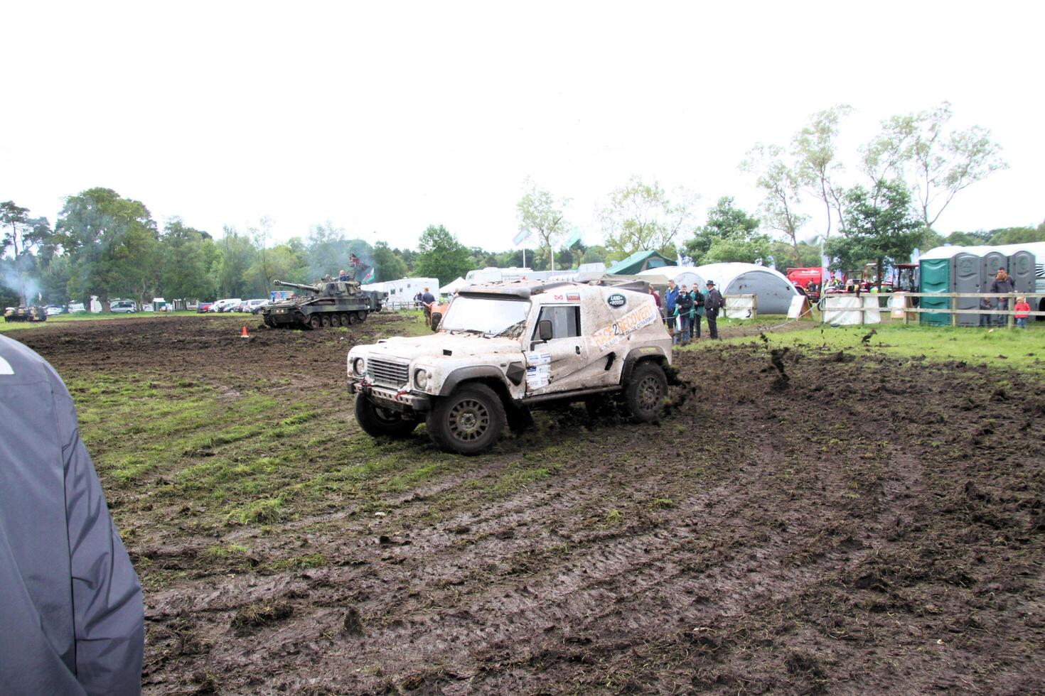 Malpas in Cheshire in the UK in September 2020. A view of a Landrover going through the mud in a field photo