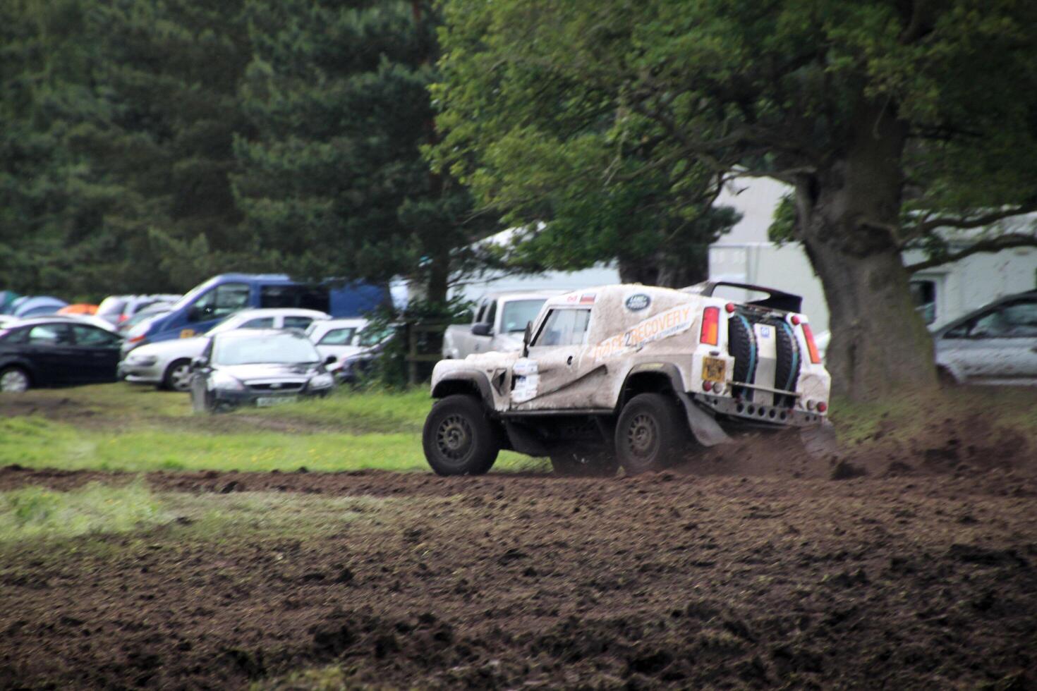 Malpas in Cheshire in the UK in September 2020. A view of a Landrover going through the mud in a field photo
