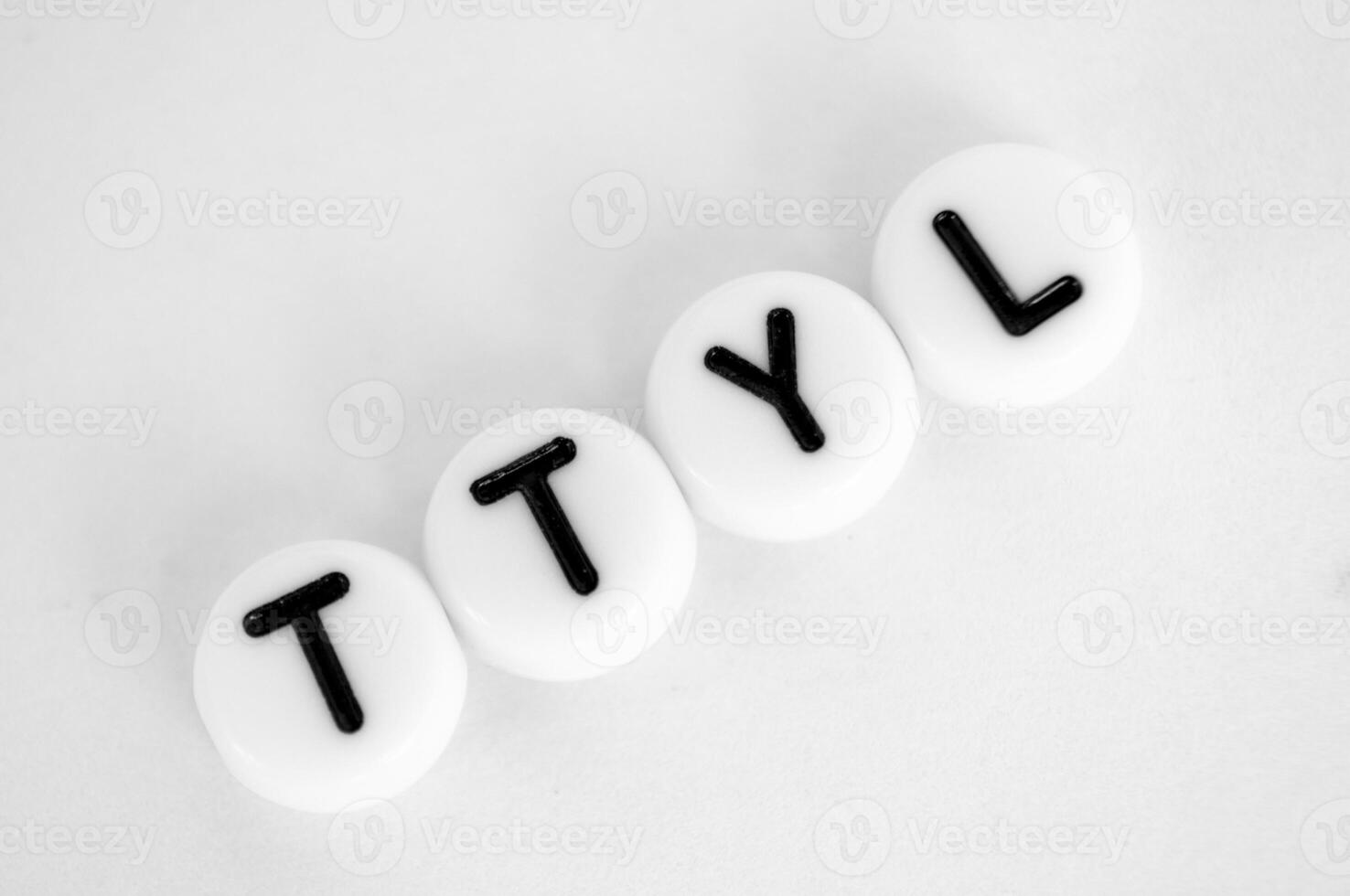 TTYL representing talk to you later text on white background photo
