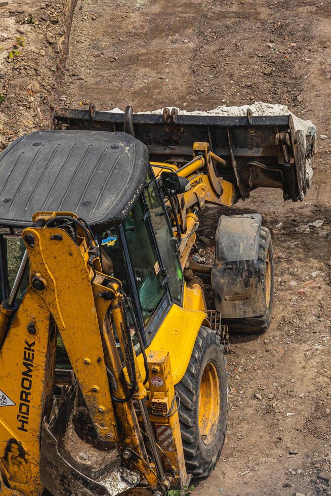 The tractor brought sand in buckets for filling Lviv Ukraine 20.05.24 photo