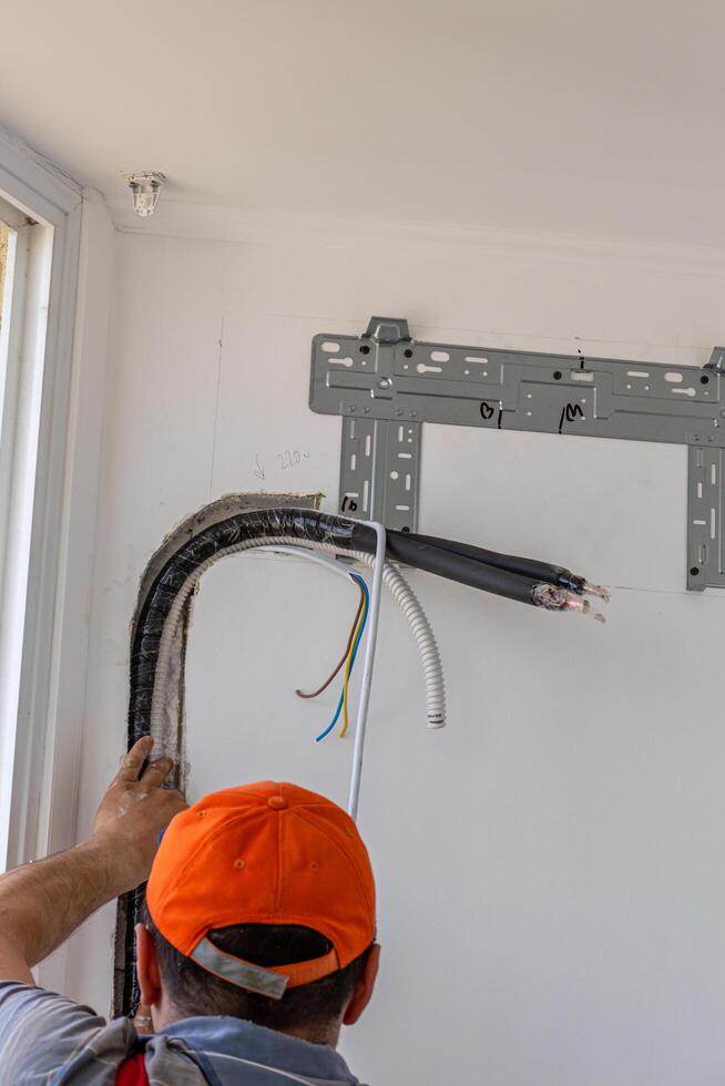 Installing an air conditioner in an apartment office Lviv Ukraine 08.04.2024 photo