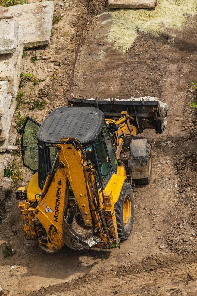 The tractor brought sand in buckets for filling Lviv Ukraine 20.05.24 photo