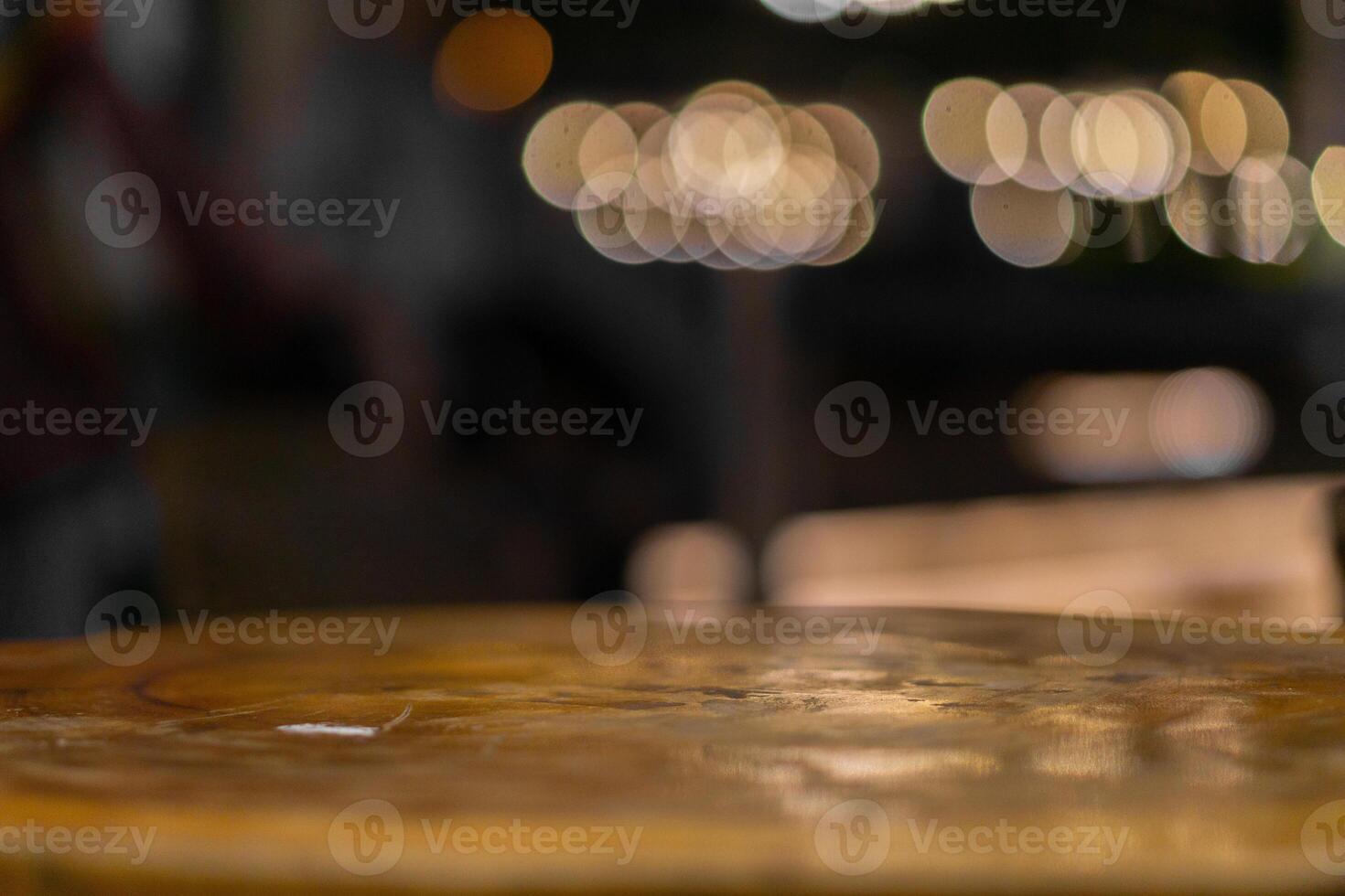 Emptty wooden table with blurred background of cafe for mockup product photo