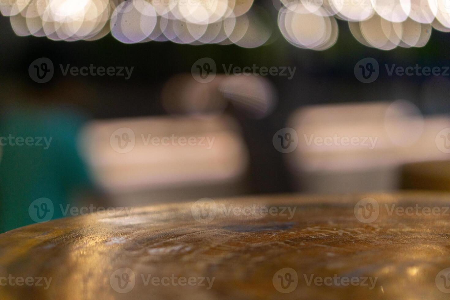 Emptty wooden table with blurred background of cafe for mockup product photo