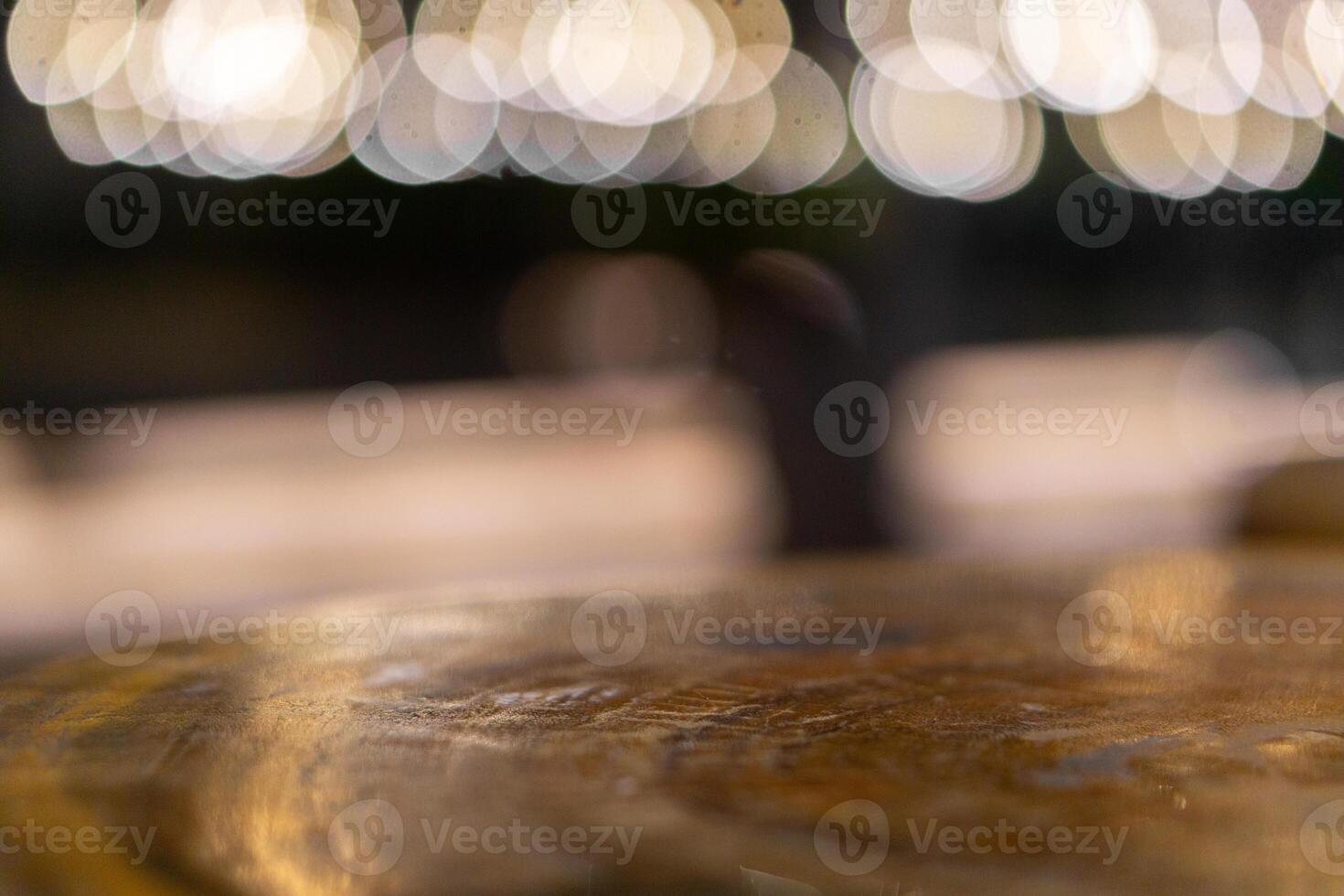 Emptty wooden table with blurred background of cafe for mockup product photo