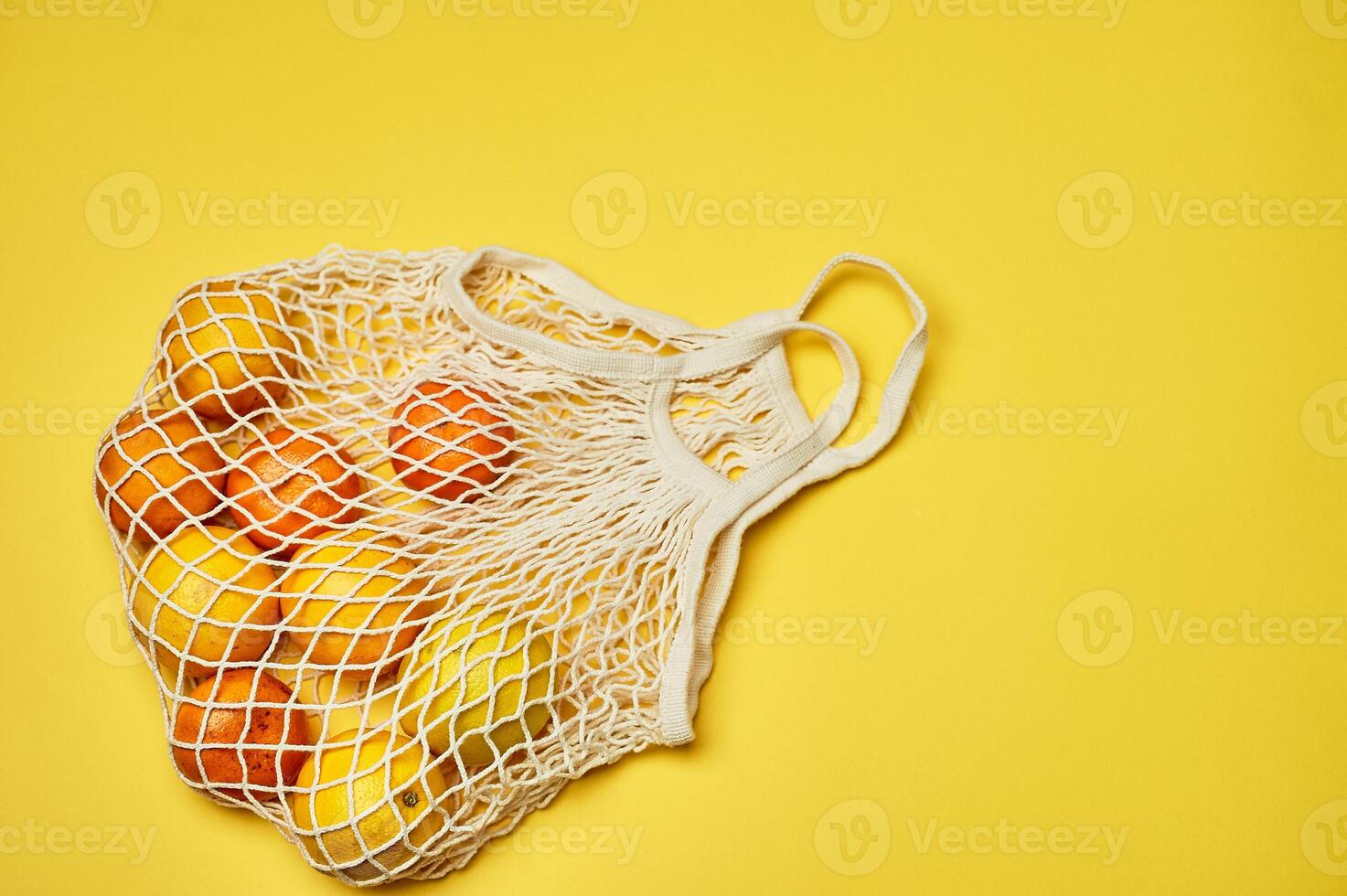 Replacing plastic bags. Taking care of the environment. Grid with fruit on colored paper, fortification. Minimalism. photo