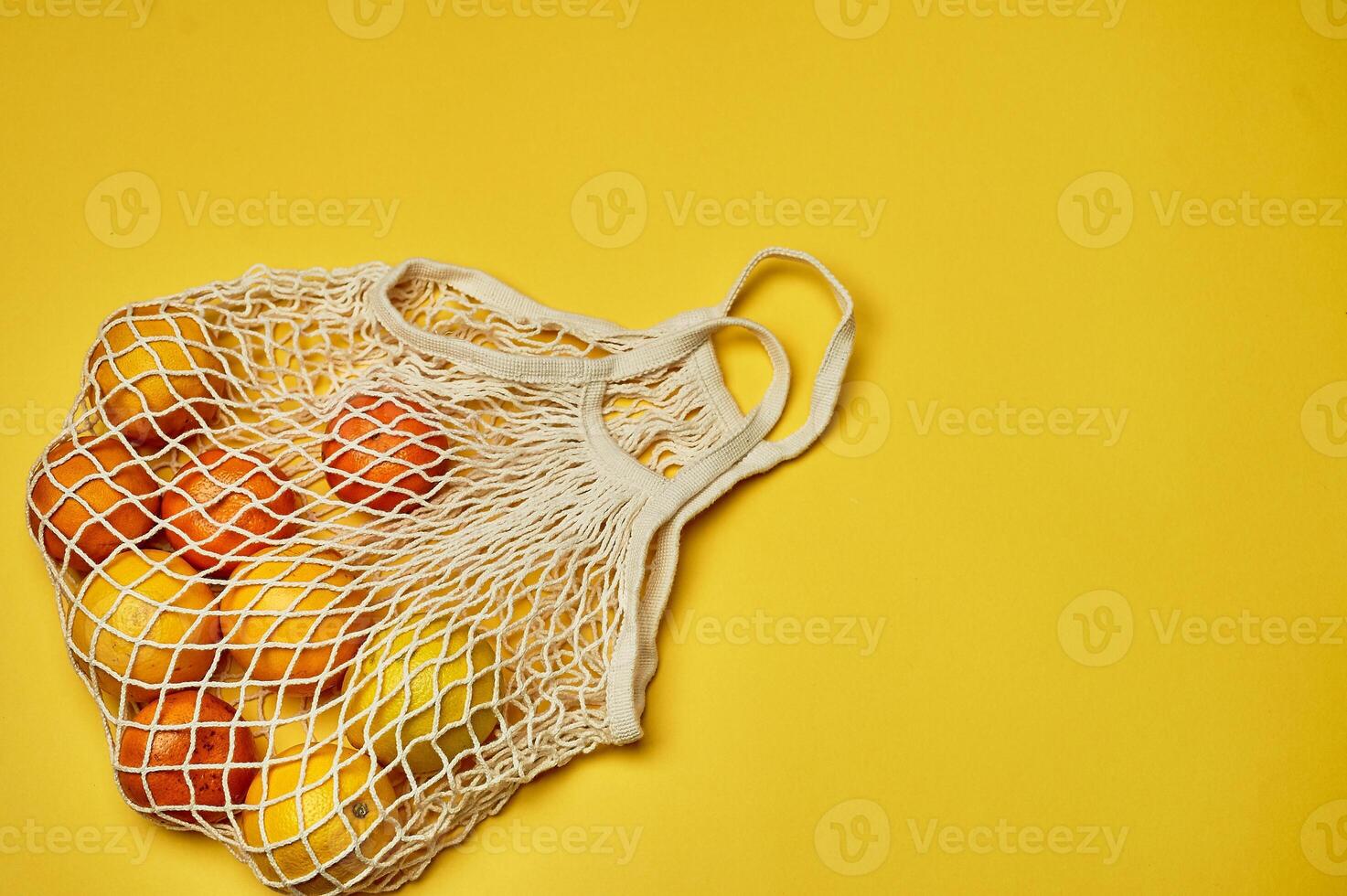 Replacing plastic bags. Taking care of the environment. Grid with fruit on colored paper, fortification. Minimalism. photo