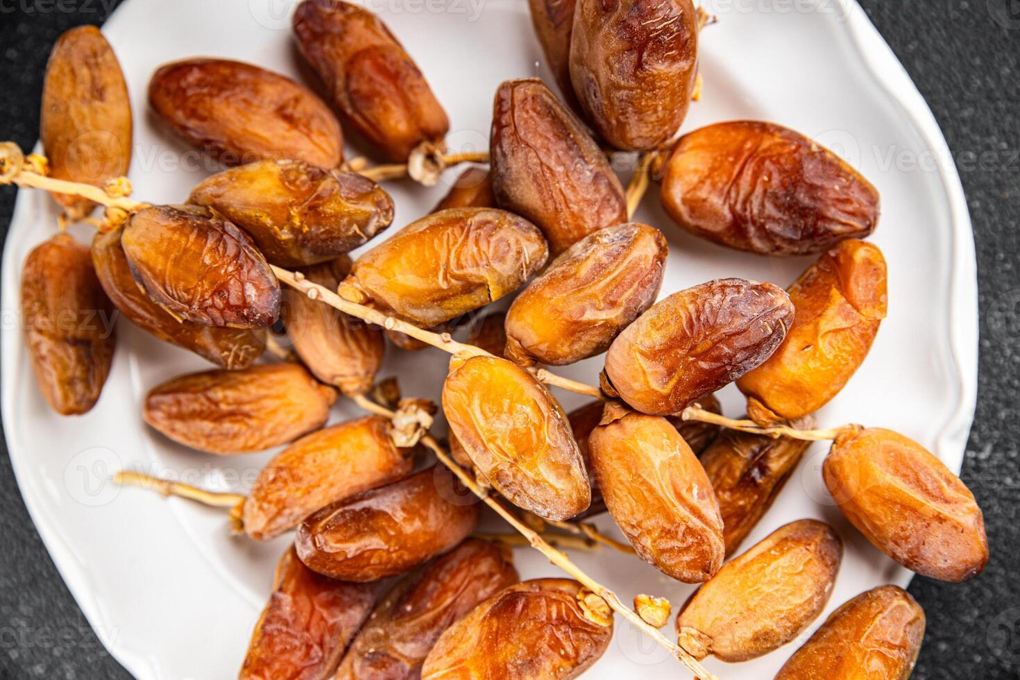 date branch dried fruit fresh appetizer food snack on the table copy space food background rustic photo