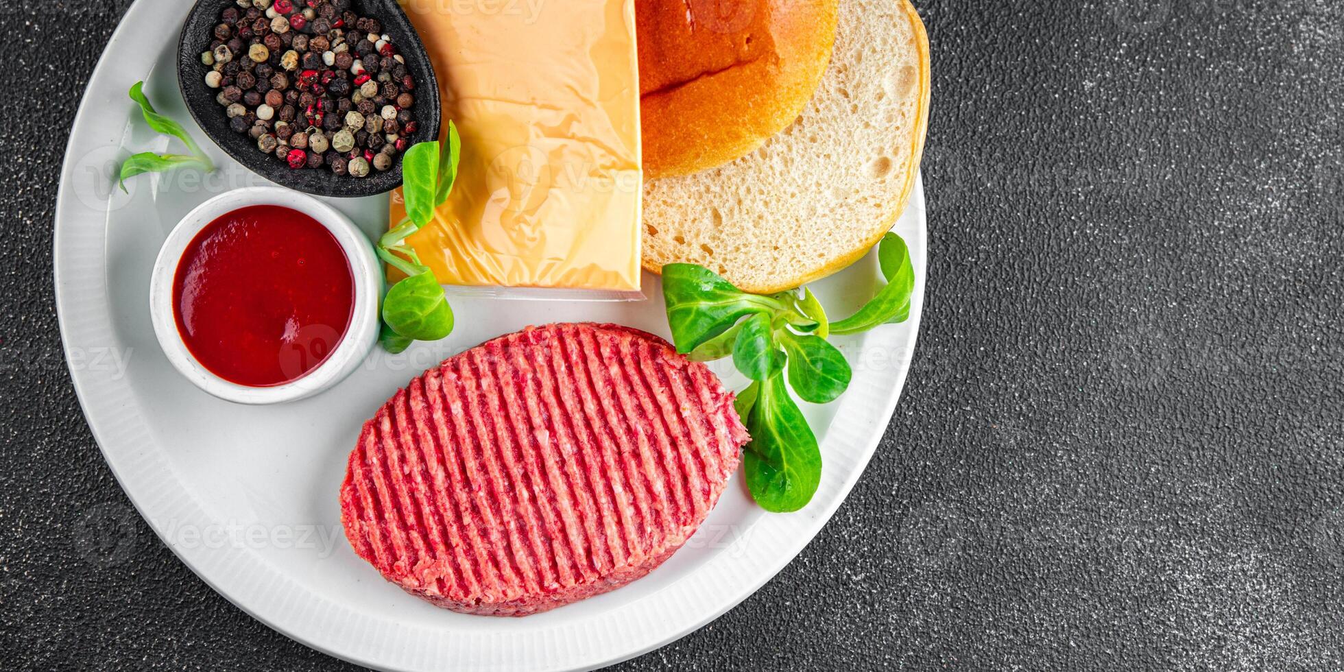 raw burger set cutlet, bun, cheese, tomato sauce, greens fresh cooking appetizer meal food snack on the table copy space food background rustic photo