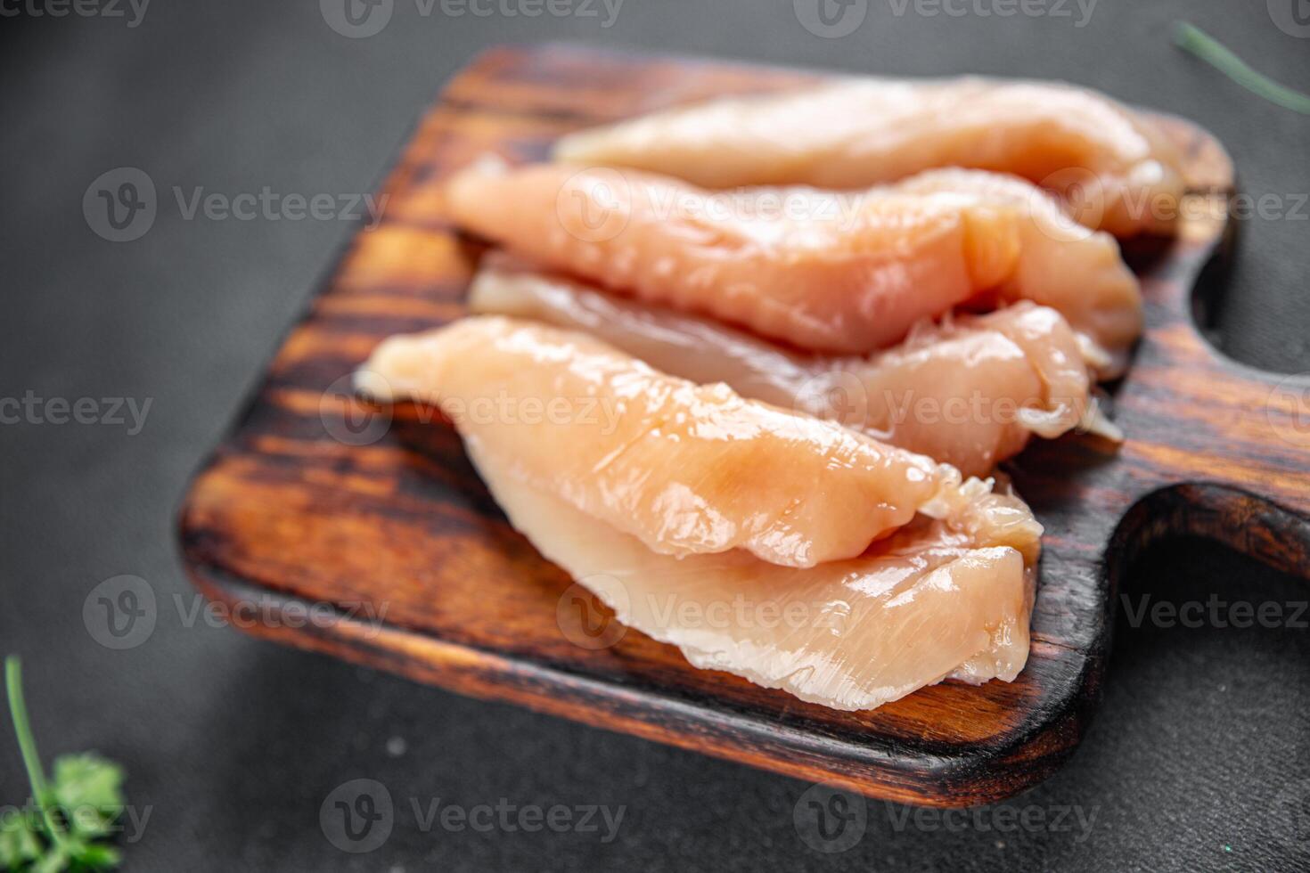 raw chicken meat aiguillettes fresh cooking meal food snack on the table copy space food background rustic top view photo