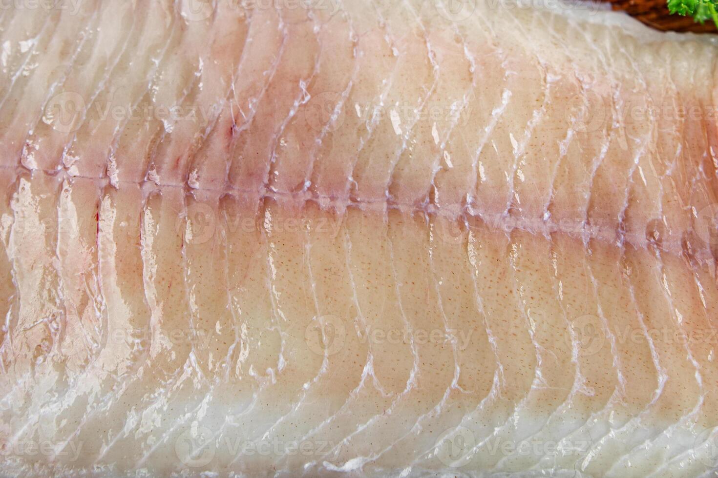 raw white fish fillet giant sea bass and filleting grouper fresh cooking appetizer meal food snack on the table copy space food background rustic top view Pescetarian diet vegetarian food photo
