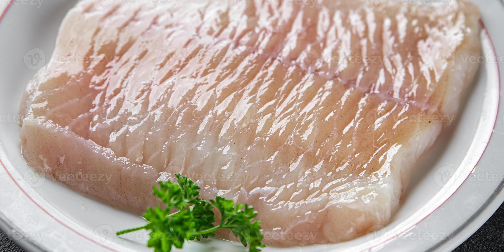raw white fish fillet giant sea bass and filleting grouper fresh cooking appetizer meal food snack on the table copy space food background rustic top view Pescetarian diet vegetarian food photo