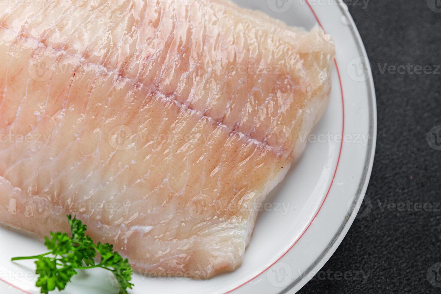 raw white fish fillet giant sea bass and filleting grouper fresh cooking appetizer meal food snack on the table copy space food background rustic top view Pescetarian diet vegetarian food photo