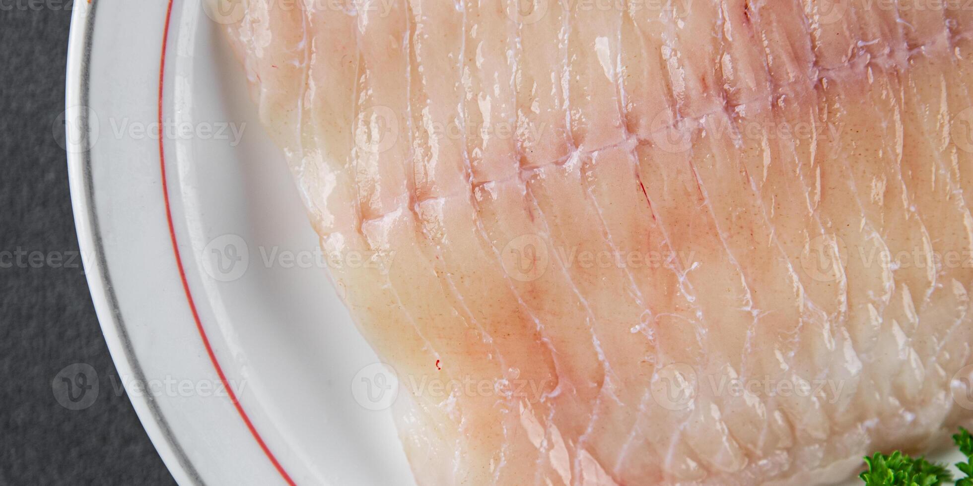 raw white fish fillet giant sea bass and filleting grouper fresh cooking appetizer meal food snack on the table copy space food background rustic top view Pescetarian diet vegetarian food photo