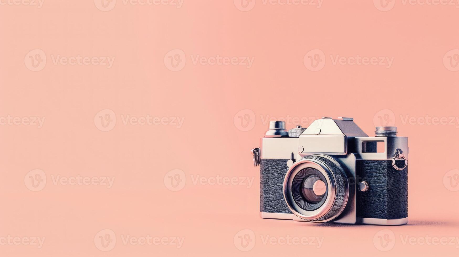 Vintage camera on a peach background with ample copyspace, capturing nostalgia photo