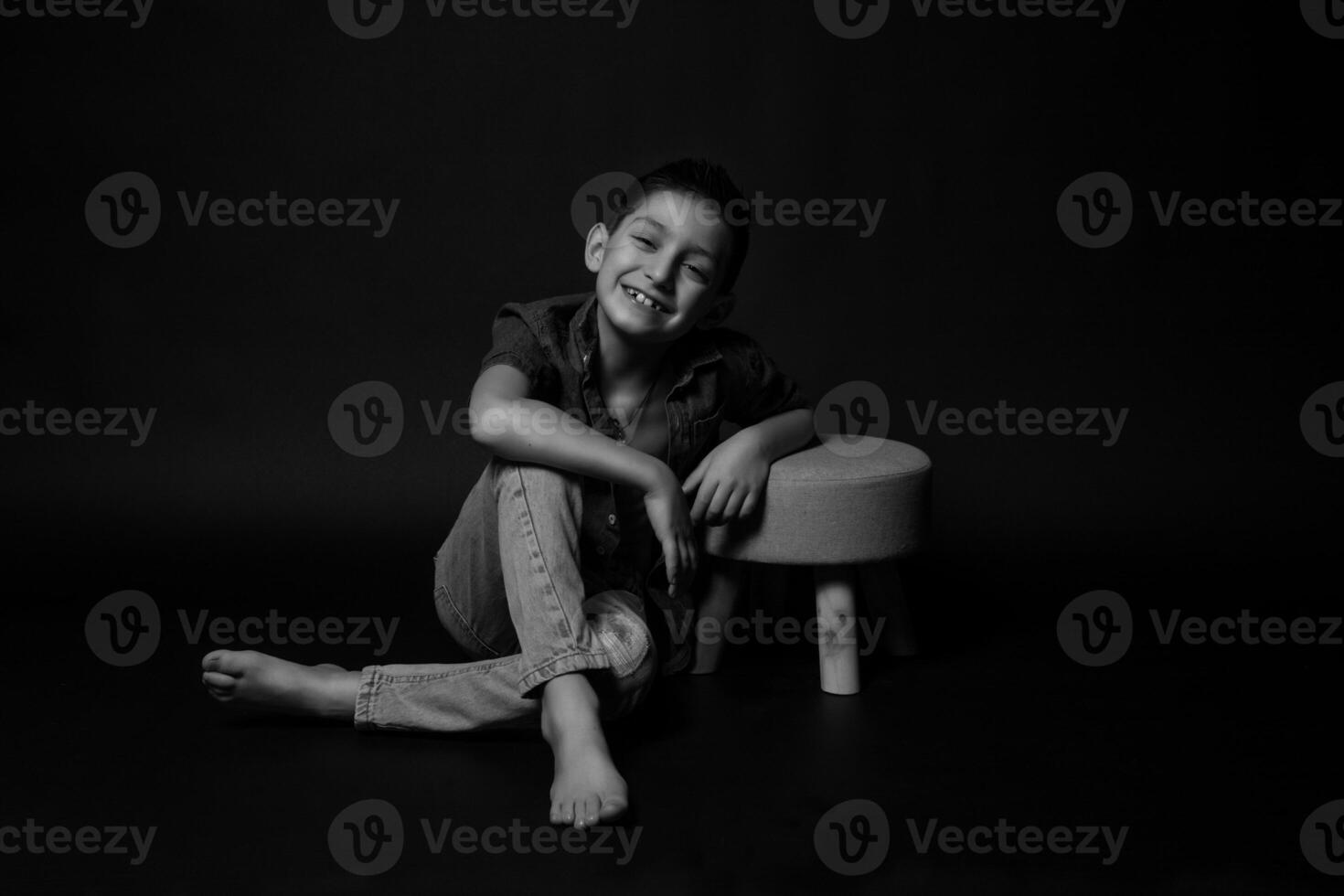 boy posing on a black background . close-up photo