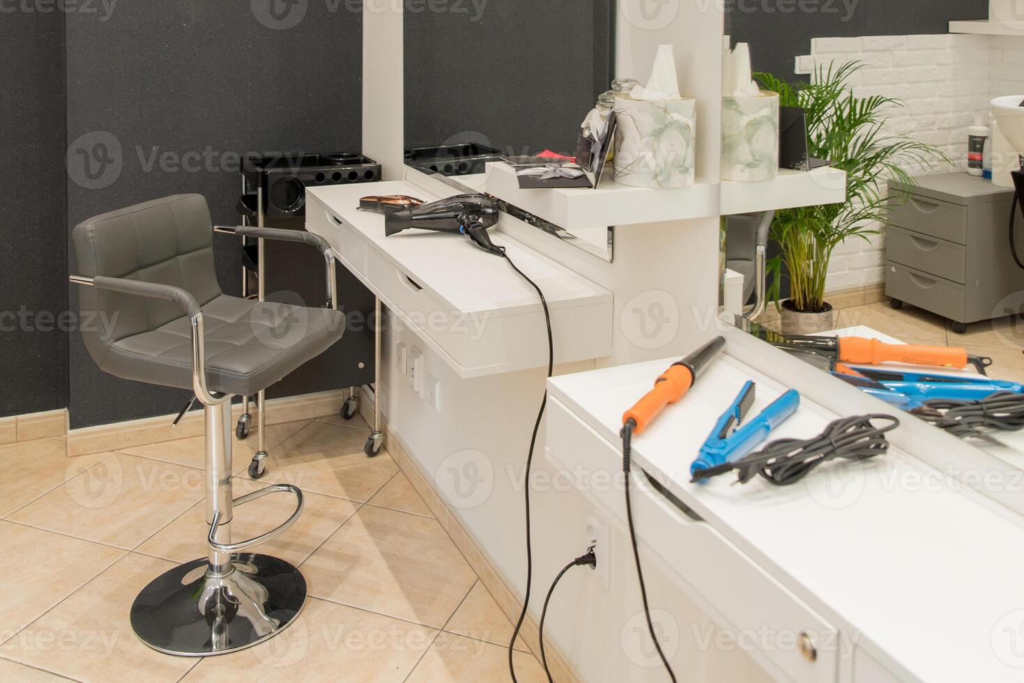 beauty saloon . salon . workplace of a hairdresser. hair dryer . curling iron. photo