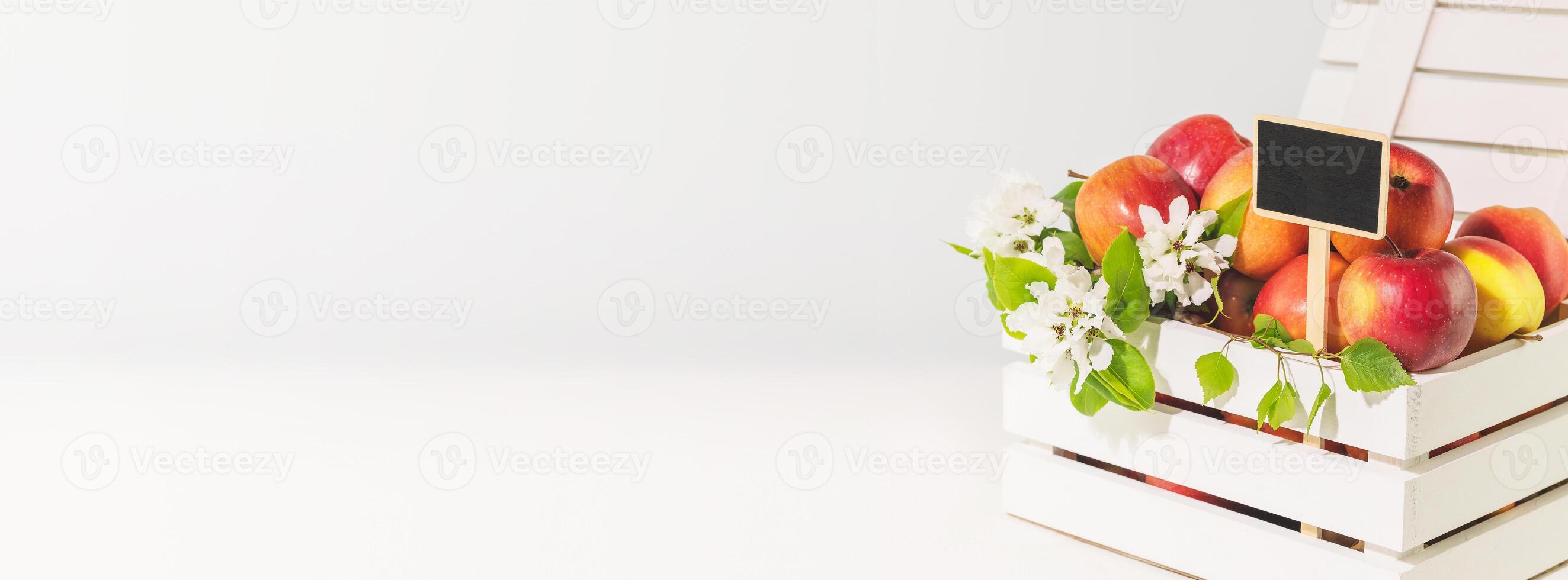 Farm apples in a white wooden box with chalkboard photo