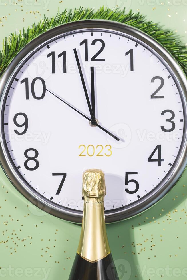 New Year banner with clock and bottle of champagne photo