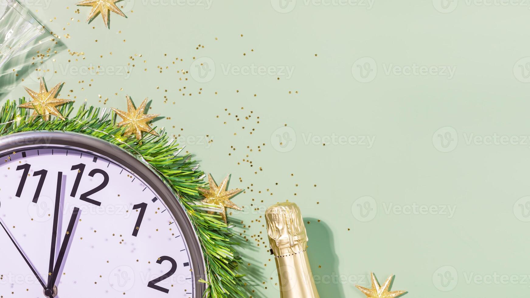 New Year banner with clock, bottle of champagne and glasses photo