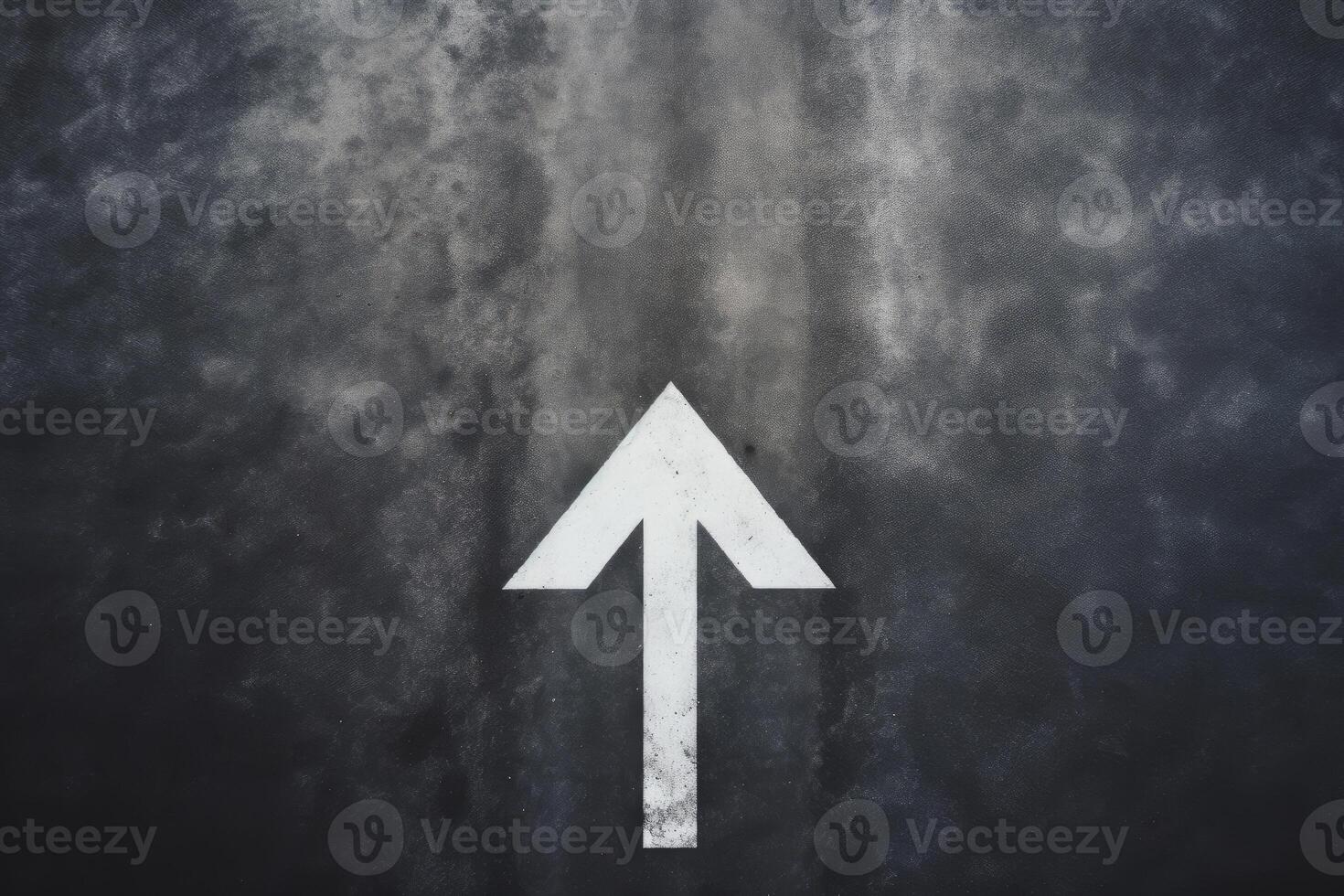 Arrow on Asphalt Road photo
