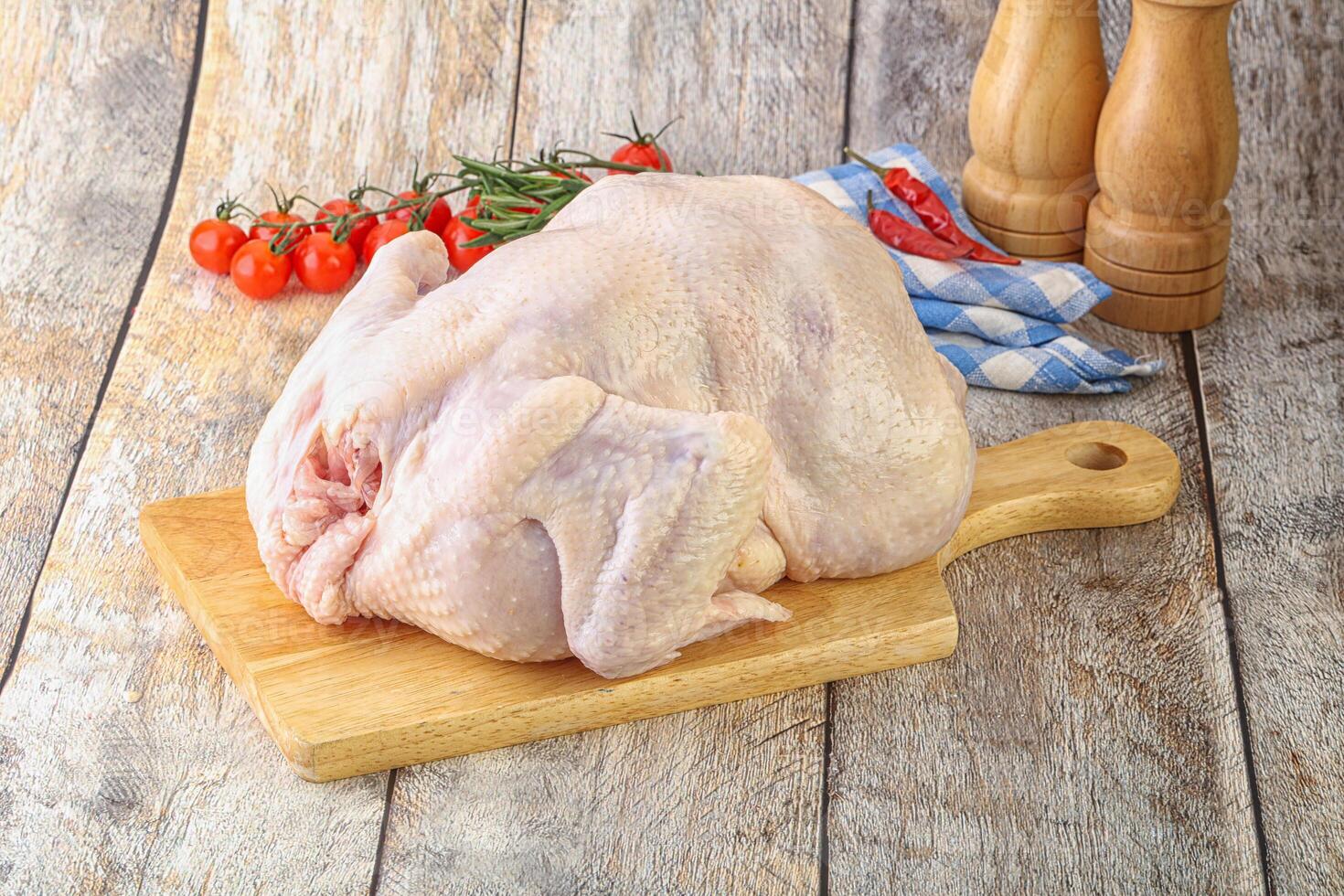 Whole raw chicken for cooking photo