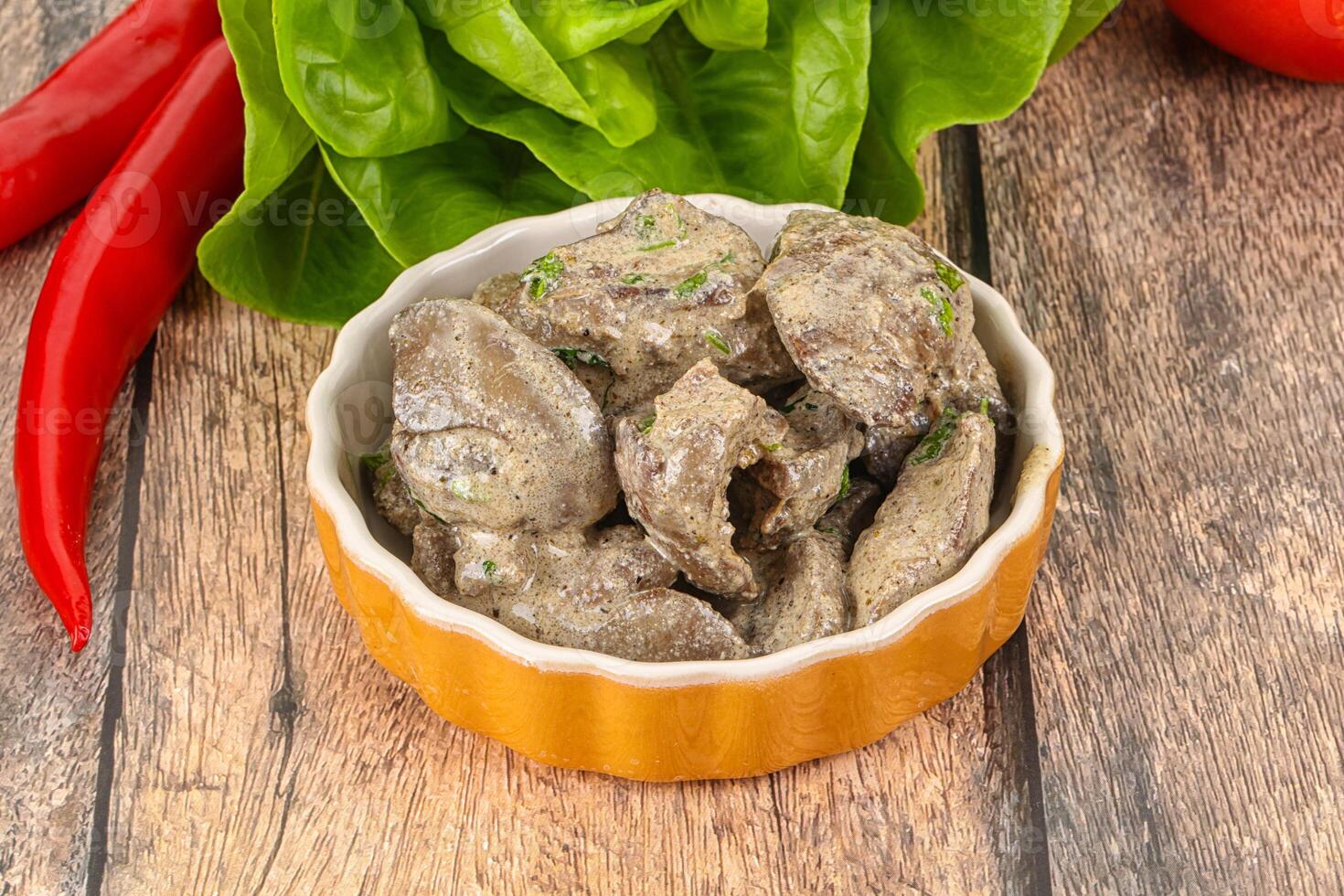 Chicken liver with cream sauce photo