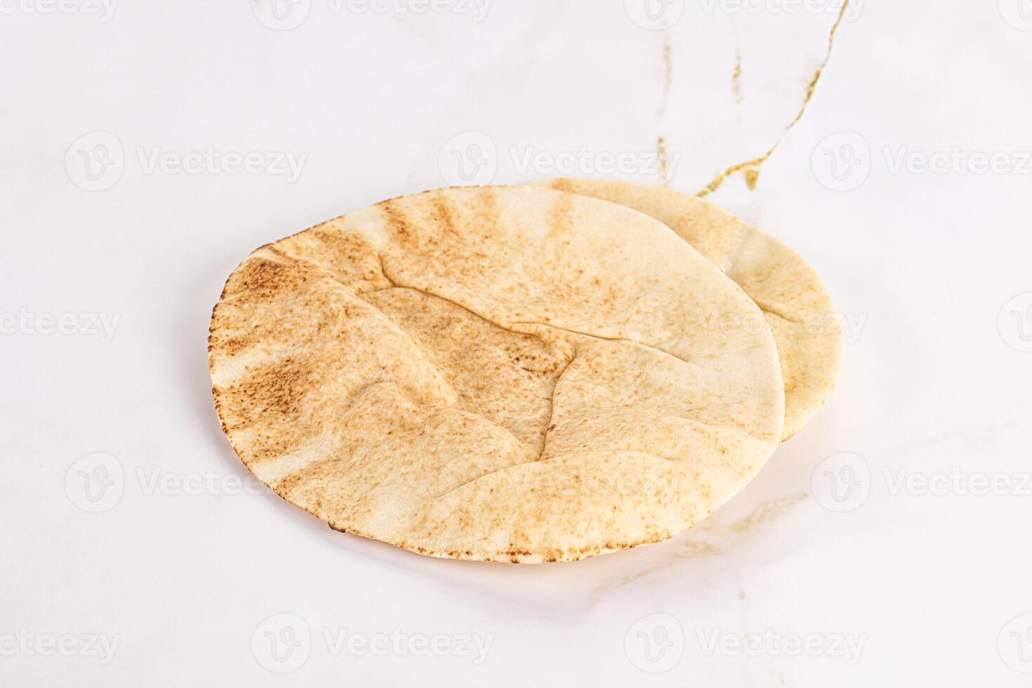 Traditional eastern round pita bread photo