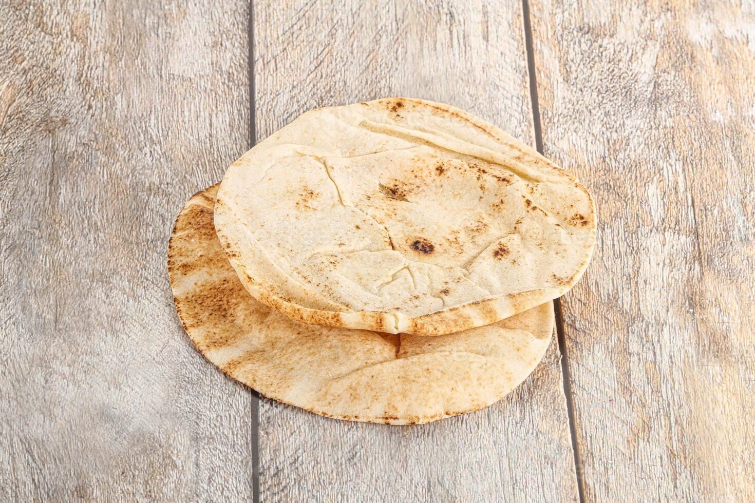 Traditional eastern round pita bread photo