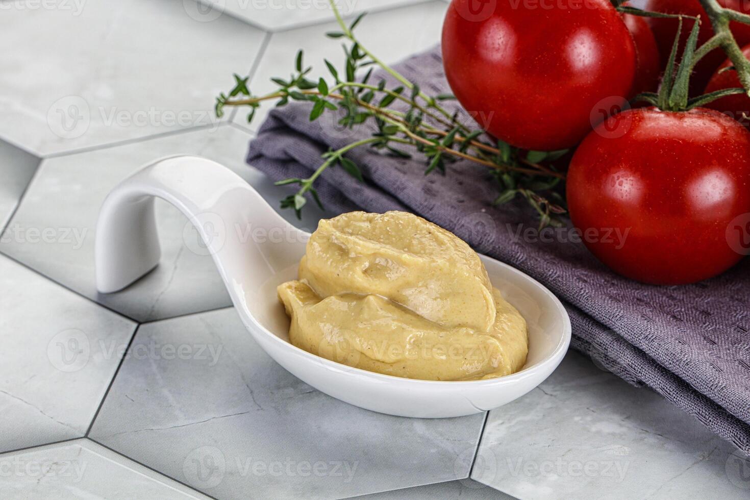 Dijon mustard sauce in the bowl photo