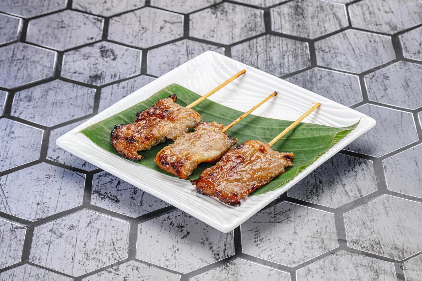 Thai cuisine - grilled pork skewer photo