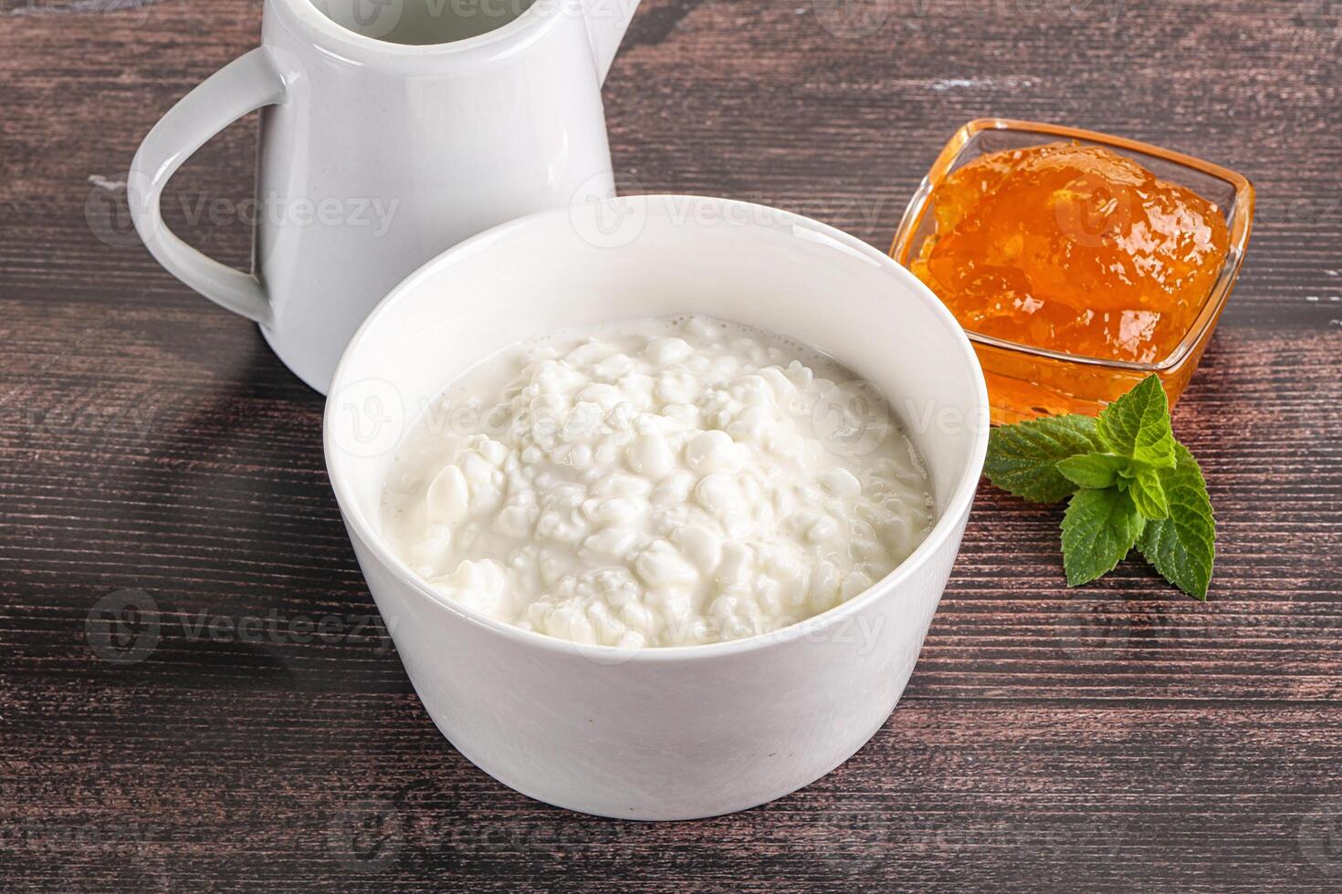 Grain curd with cream and jam photo