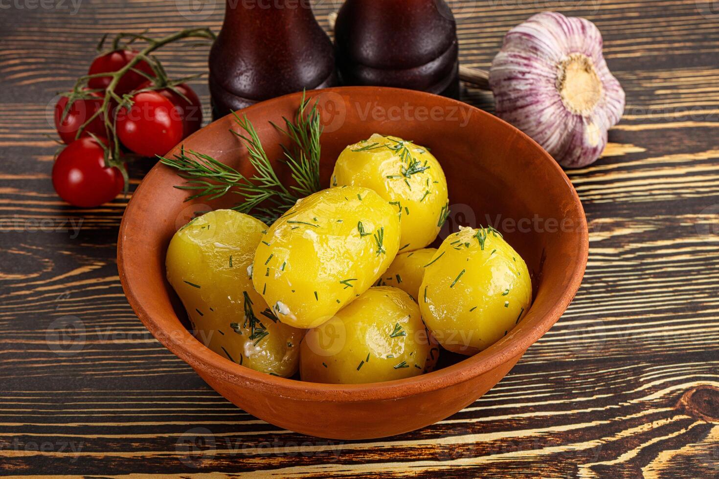 Boiled potato with oil and dill photo