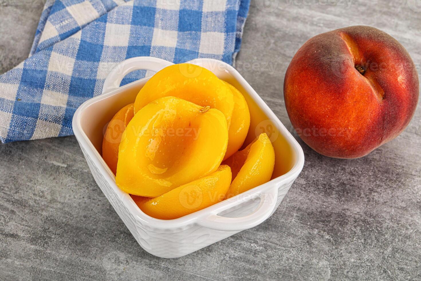 Ripe sweet and juicy canned peach photo
