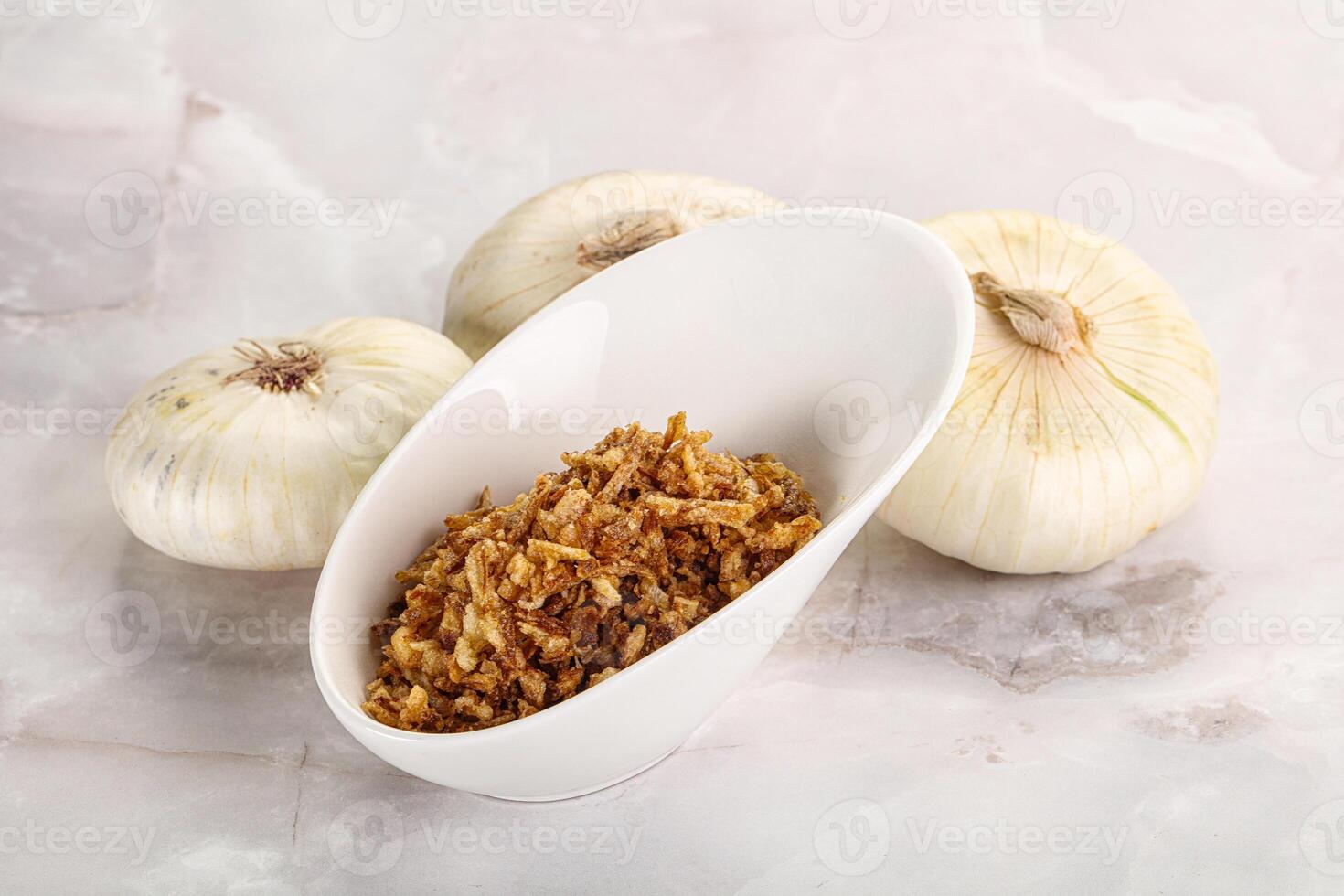 Dried roasted onion flakes for culinary photo