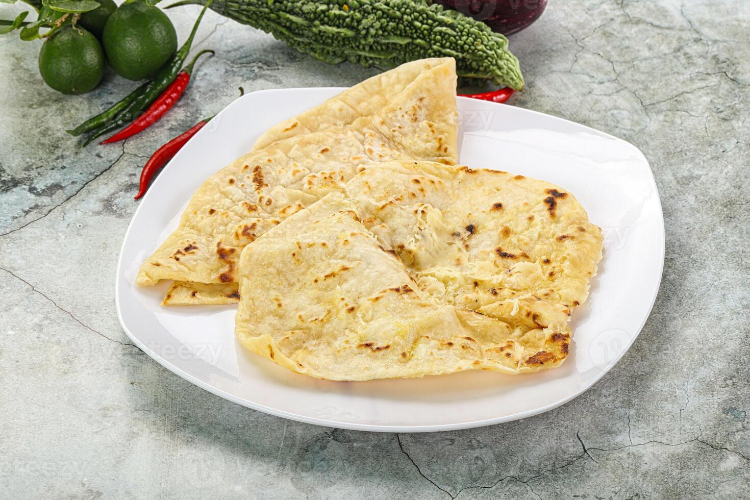 Indian tandori bread - naan with cheese photo