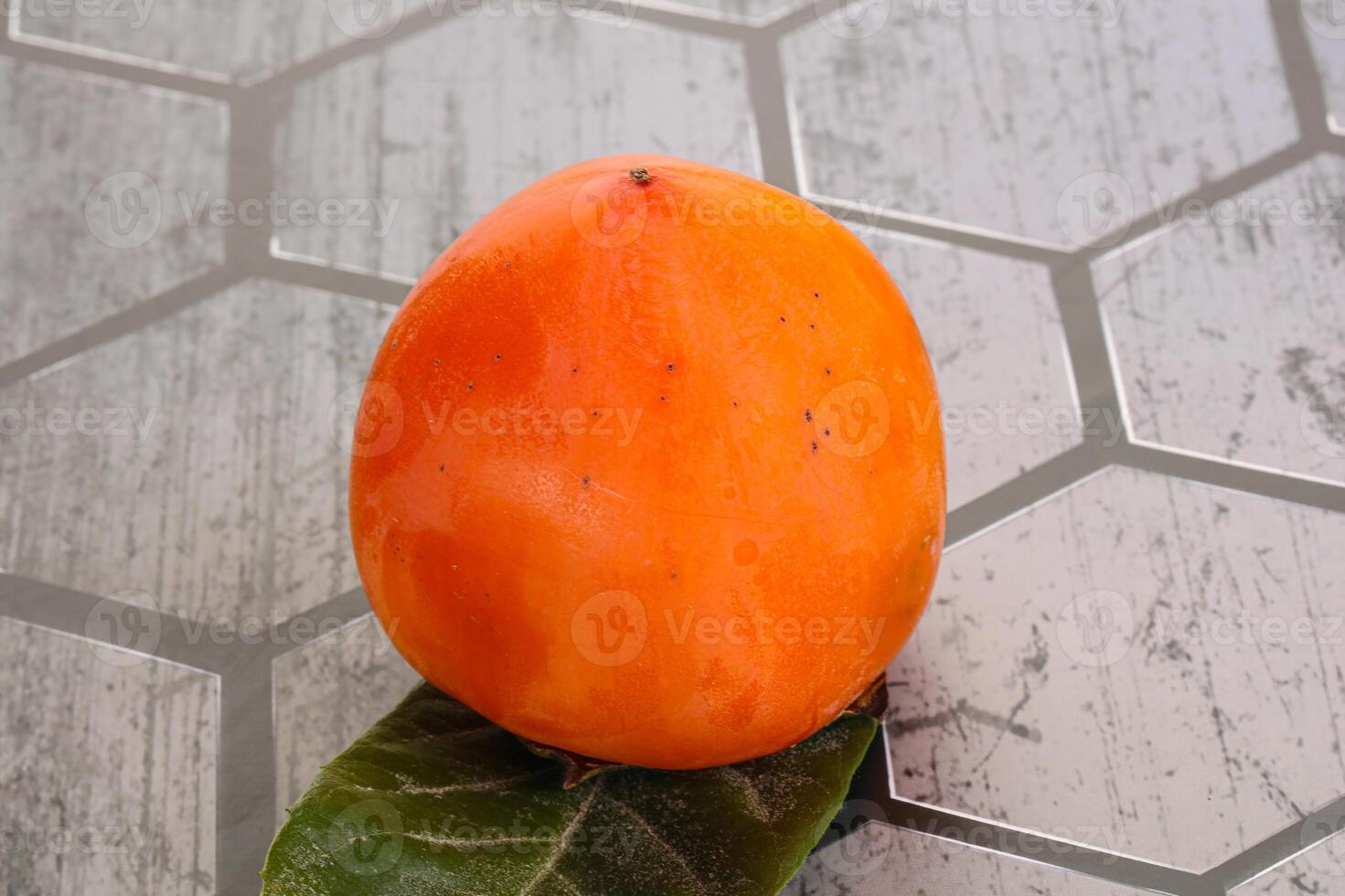 Fresh ripe sweet juicy persimmon photo