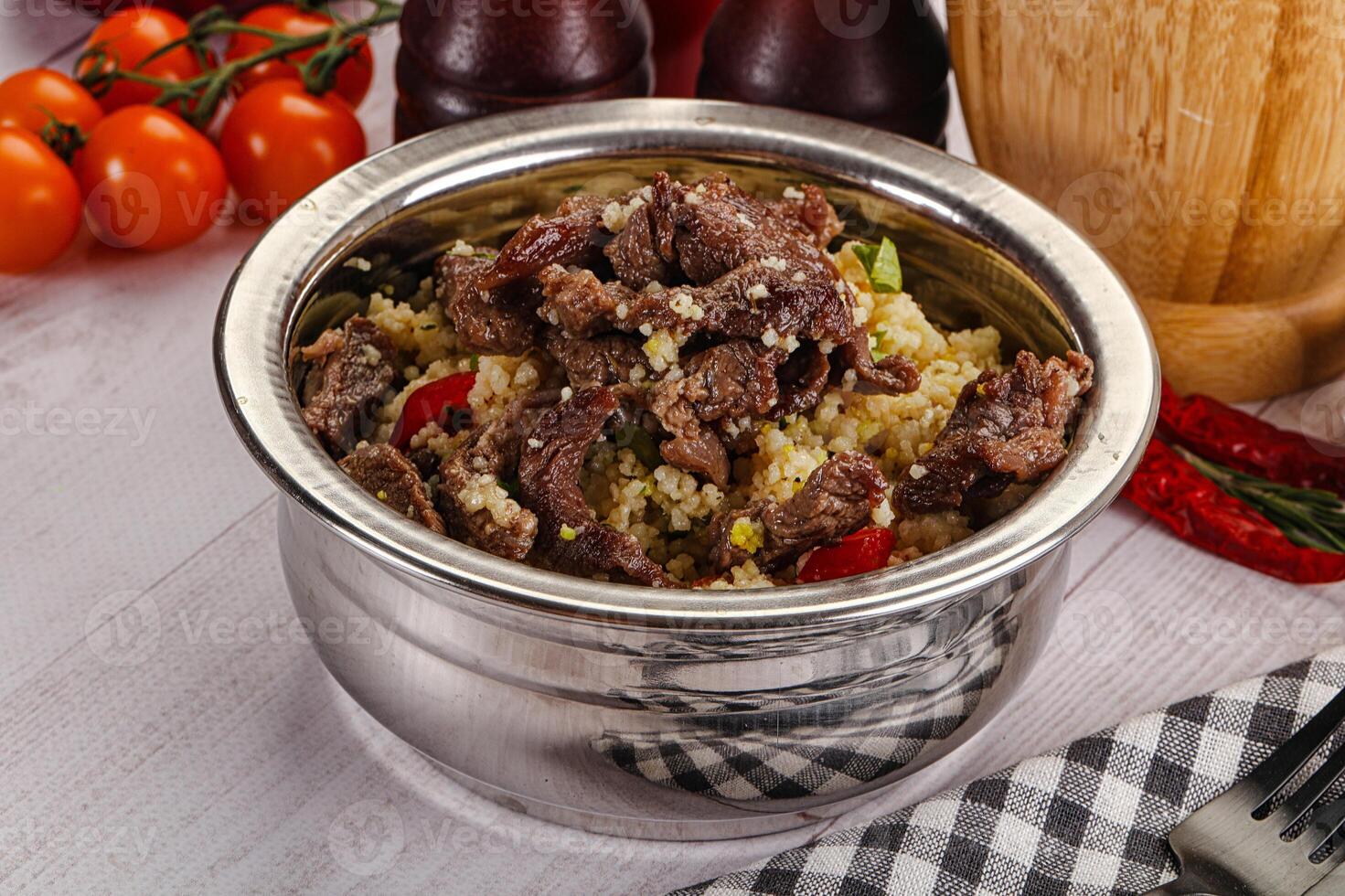 Traditional couscous with beef and vegetables photo