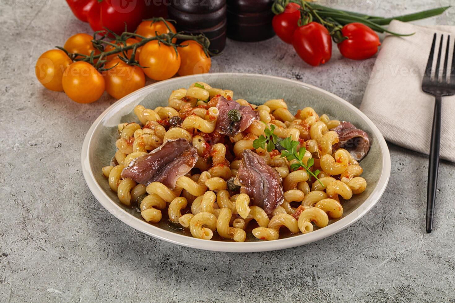 Italian pasta cellentani with anchovy photo