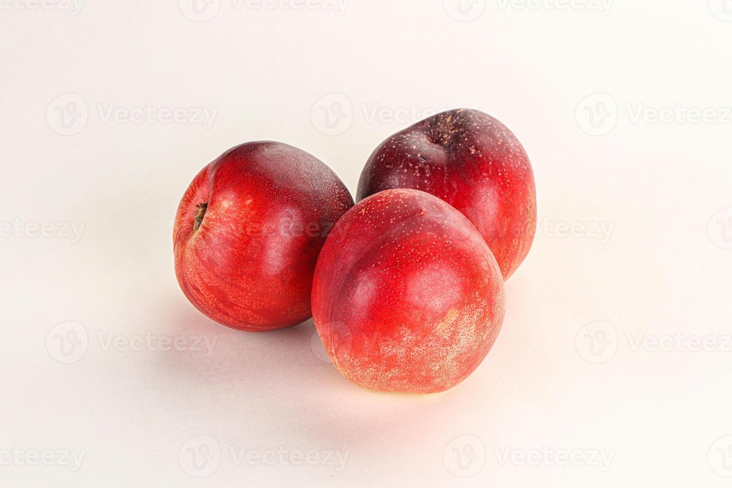 Ripe sweet juicy nectarines heap photo