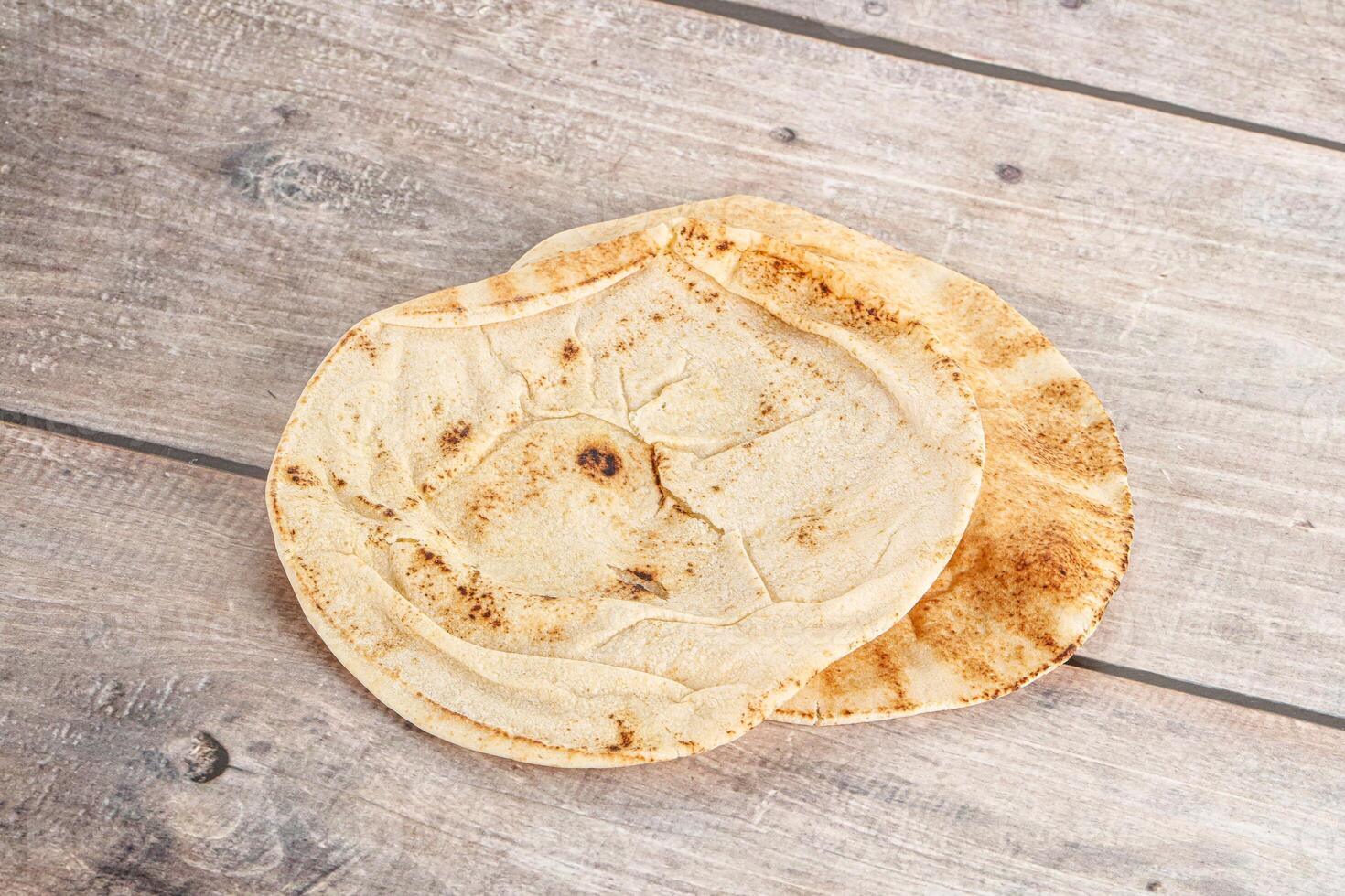 Traditional eastern round pita bread photo