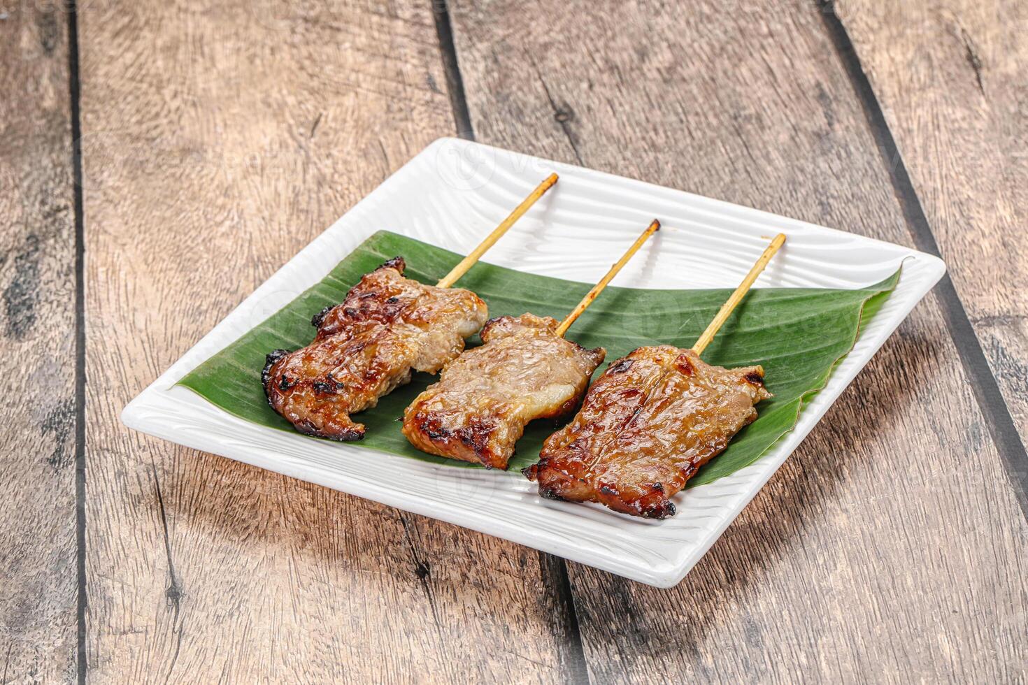 Thai cuisine - grilled pork skewer photo