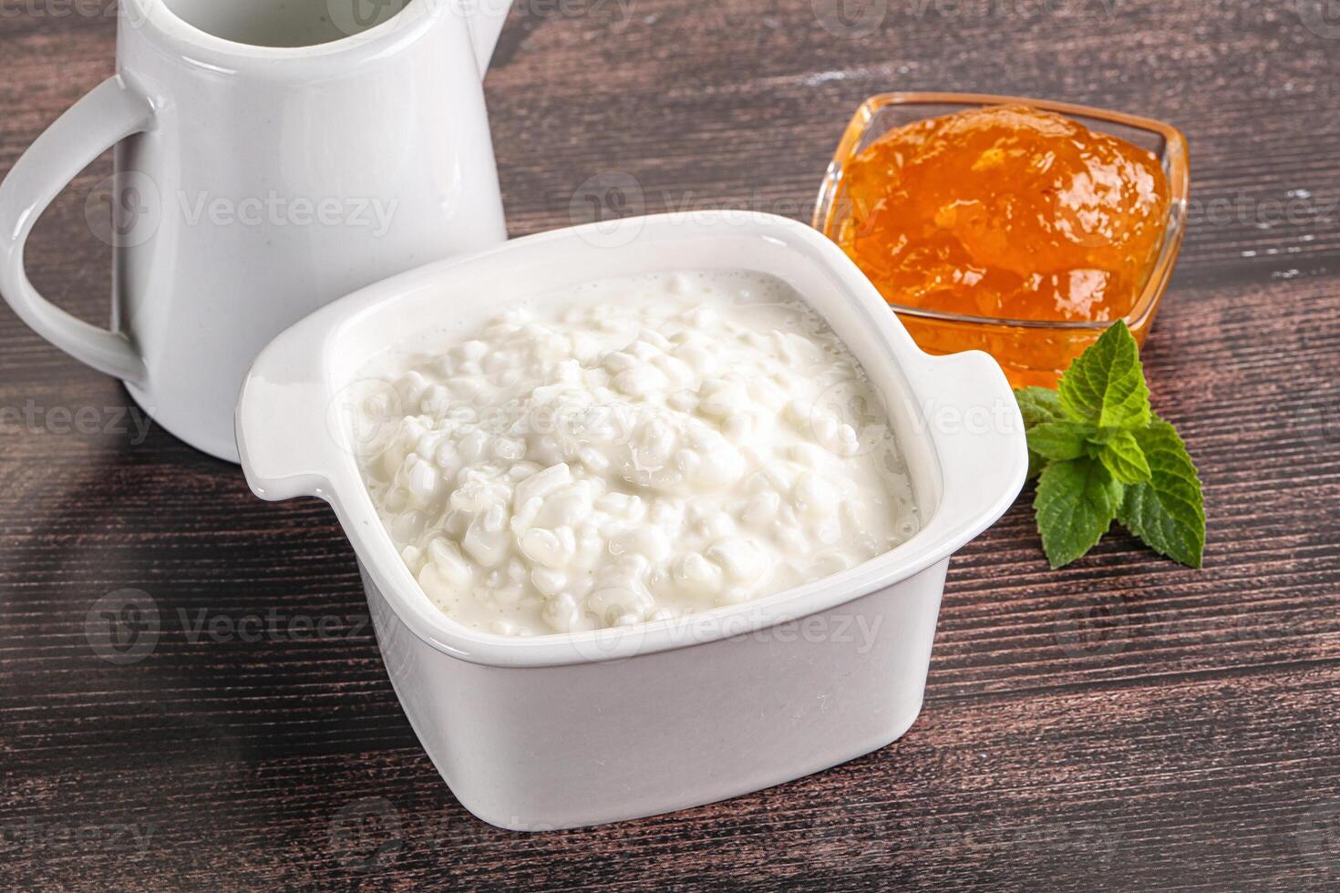 Grain curd with cream and jam photo