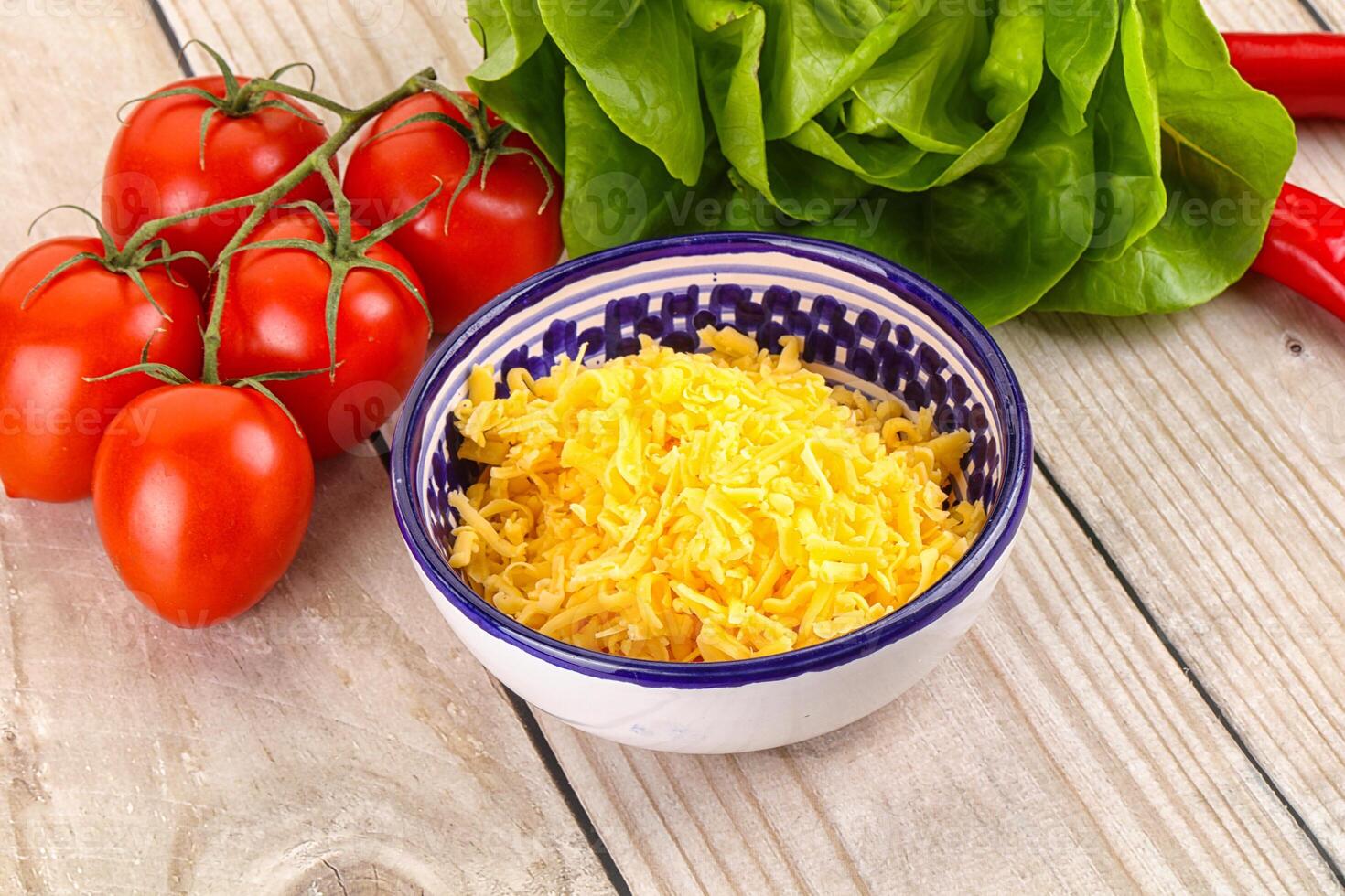 Shredded cheese in the bowl photo