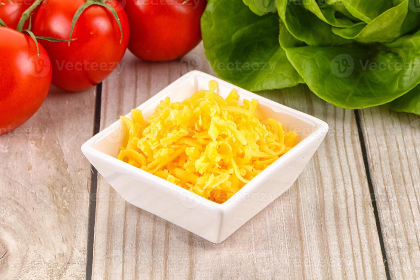 Shredded cheese in the bowl photo