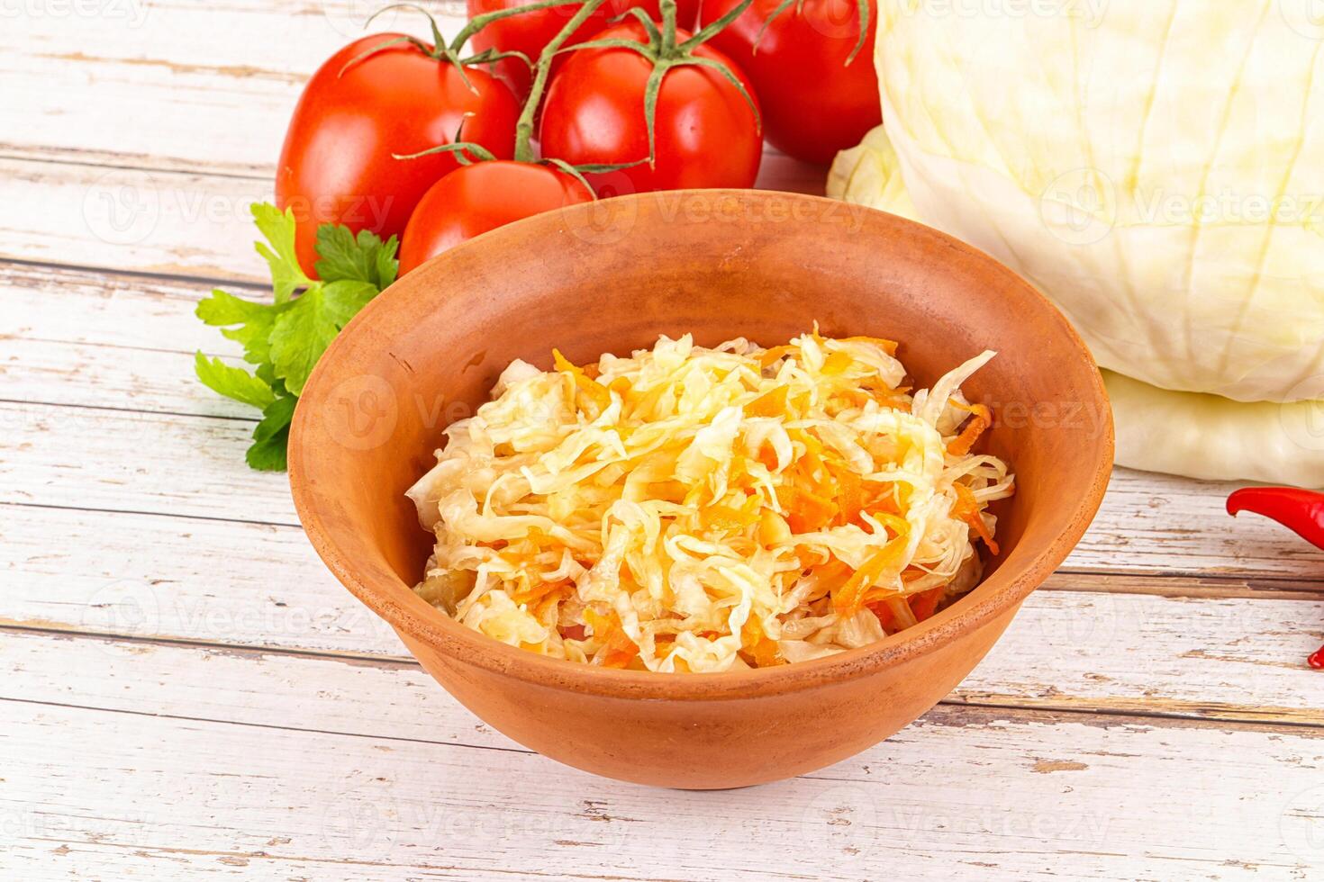 Fermented cabbage sauerkraut in the bowl photo