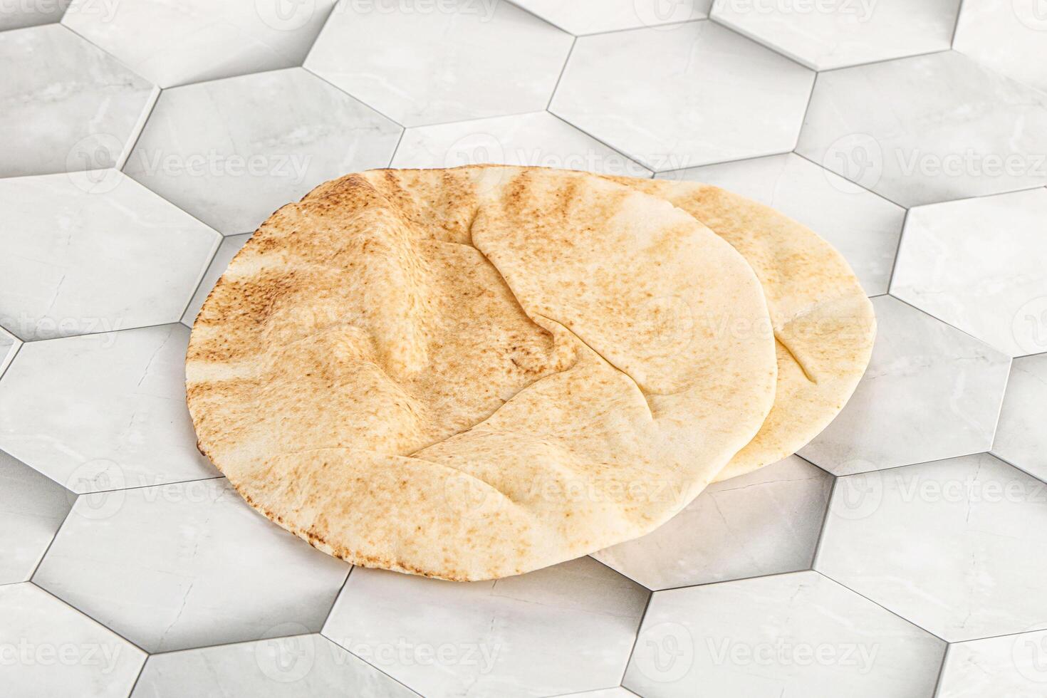 Traditional eastern round pita bread photo